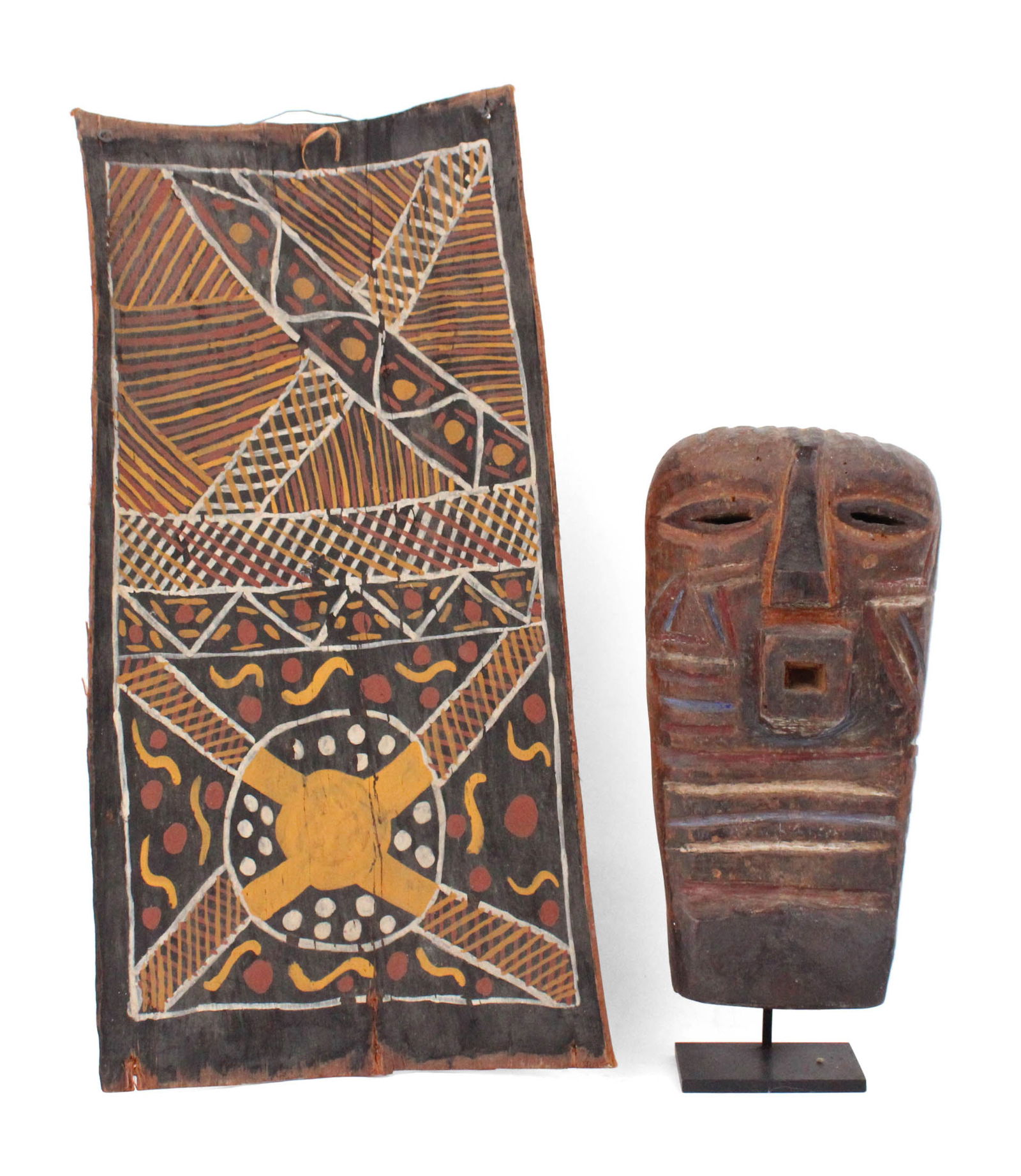 Songye Kifwebe Carved and Painted Mask: Songye Kifwebe Carved and Painted MaskPossibly a reproduction. Together with a Tiwi Islands bark painting featuring clan designs, possibly a reproduction. 2 pieces.10 3/4 x 5 1/4 in. (27.3 x 13.3 cm.)