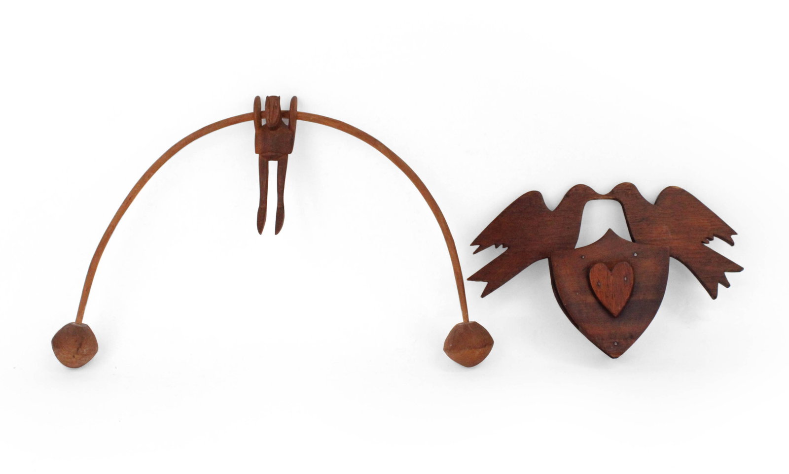 Folk Art Carved Wood Balancing Man: Folk Art Carved Wood Balancing Man 19th C. Together with carved wood love bird hanging plaque. 2 pieces. Largest: 10 x 15 1/2 in. (25.4 x 39.4 cm.)