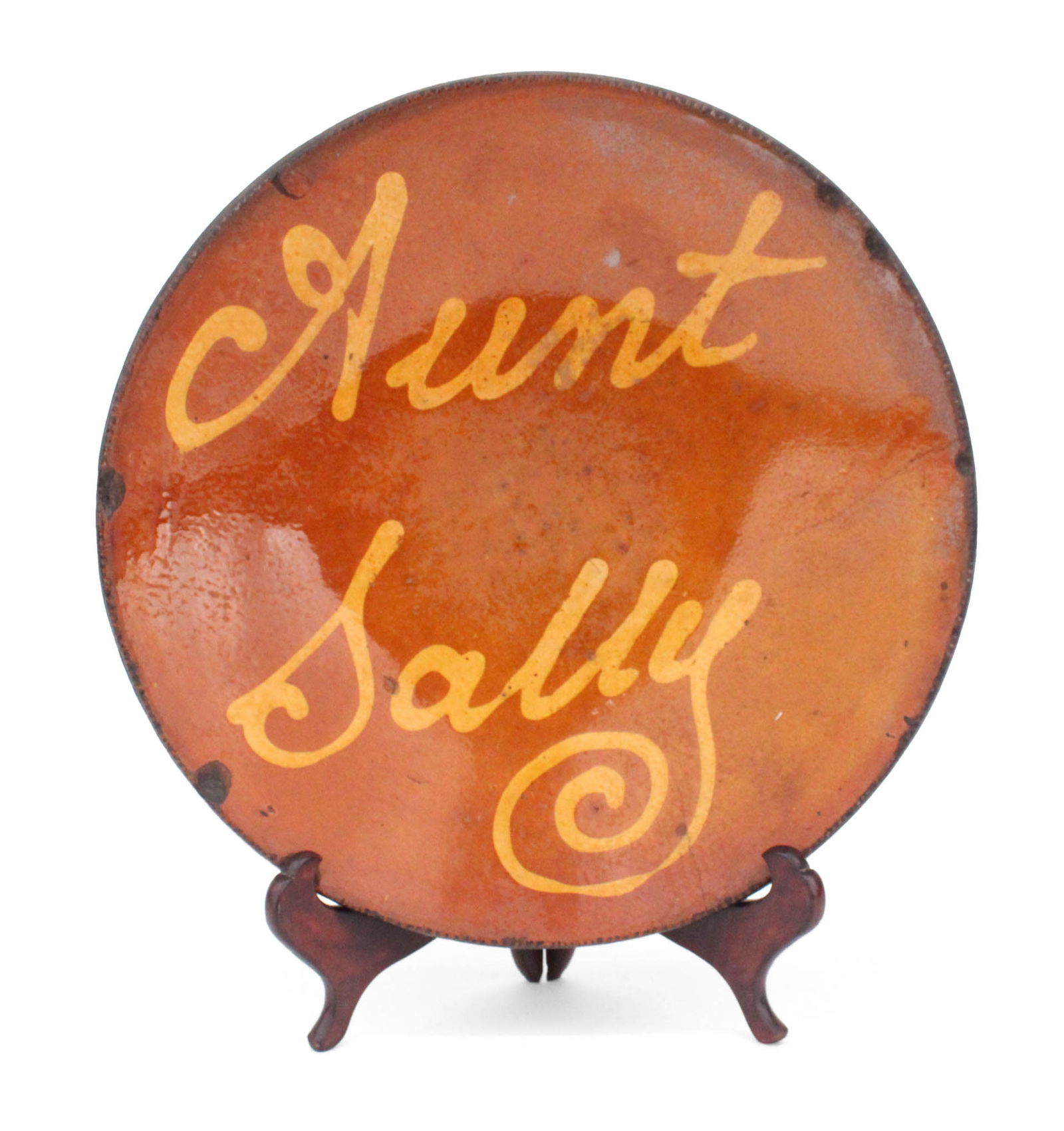 Redware "Aunt Sally" Plate: Redware "Aunt Sally" PlateC. 1850, George Wolfkiel, Bergen County, NJ.Provenance: Lew Scranton, Connecticut Antiques Show 20032 1/4 x 12 in. (5.7 x 30.5 cm.)