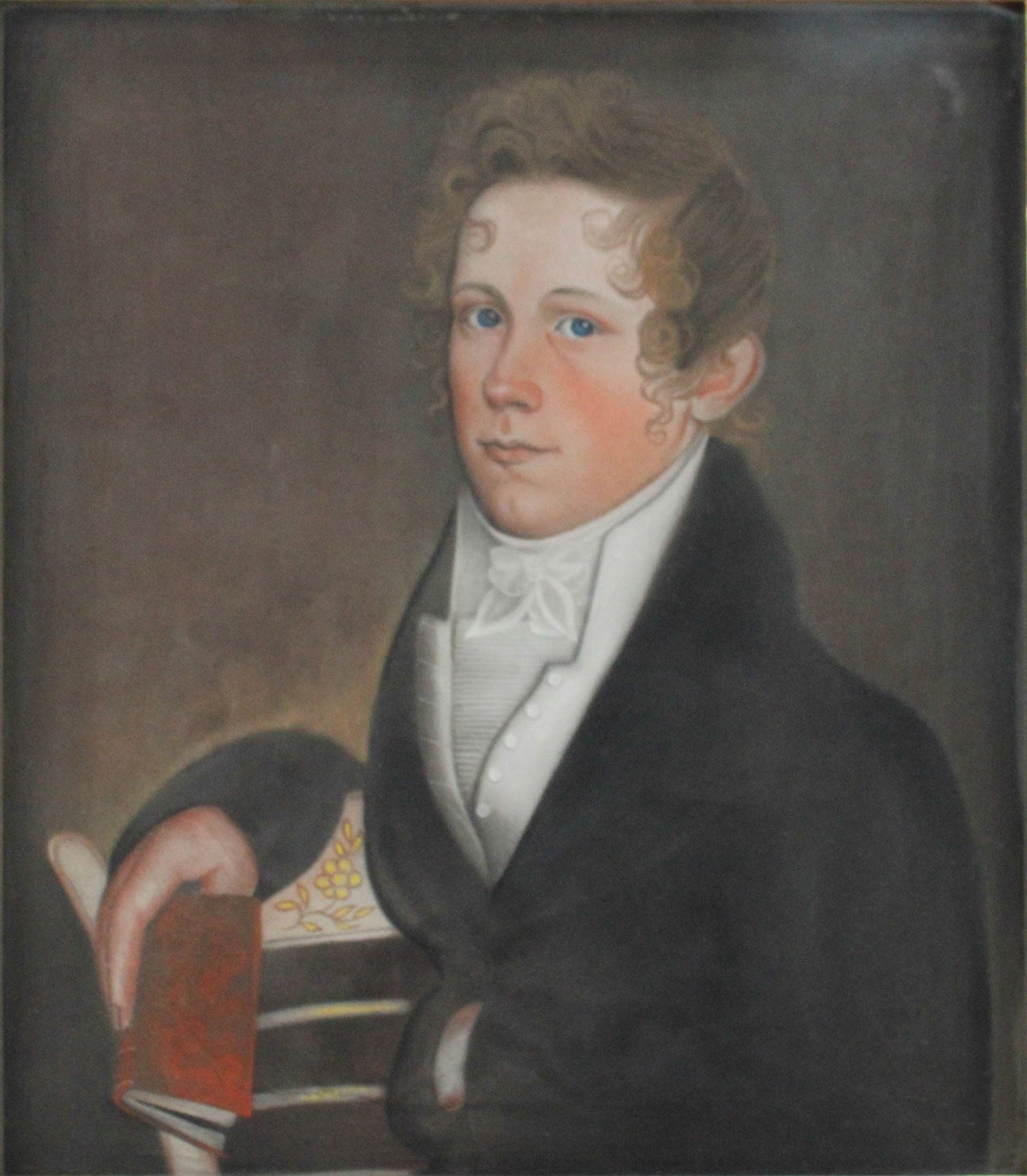 William M S Doyle, 1769-1828, Young Man with a Red Book, Pastel on Paper: William M S Doyle1769-1828Young Man with a Red BookPastel on Papercirca 1815.Provenance:M. Austin and Jill R. Fine Collection;Sotheby's, New York, Americana from the Collection of M. Austi