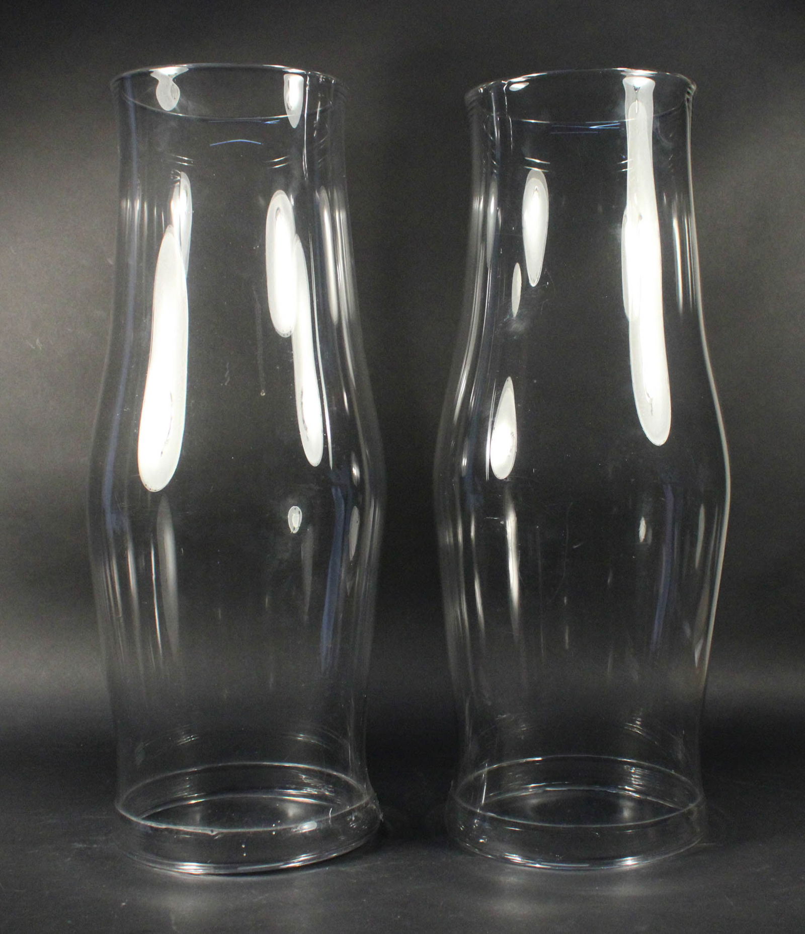 Pair of Colorless Glass Hurricane Shades: Pair of Colorless Glass Hurricane Shades20th C.21 1/2 x 9 in. (54.6 x 22.9 cm.)