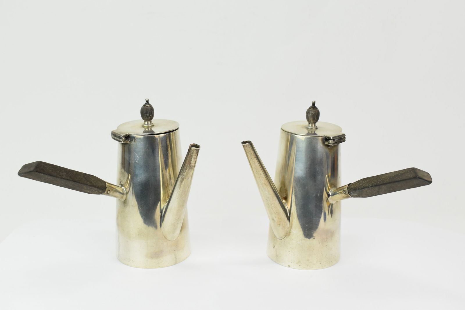 Pair of Asprey Hot Chocolate Pots: Pair of Asprey Hot Chocolate PotsPair of Asprey Hot Chocolate Pots each measures 5 1/2" tall x 6" x 4". Used condition, dents.