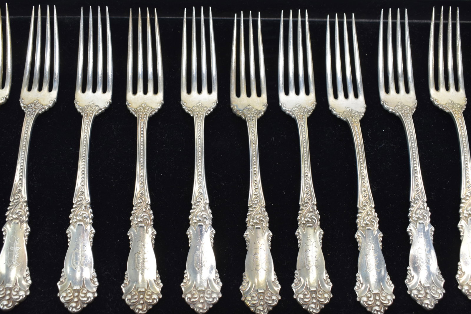 Set of Eleven Reed and Barton Buttercup Forks: Set of Eleven Reed and Barton Buttercup Forks Set of Eleven Reed and Barton Buttercup Pattern Forks. Each having monogram. Used condition. each measures 7 1/8" long. Approximately 18 t.o.
