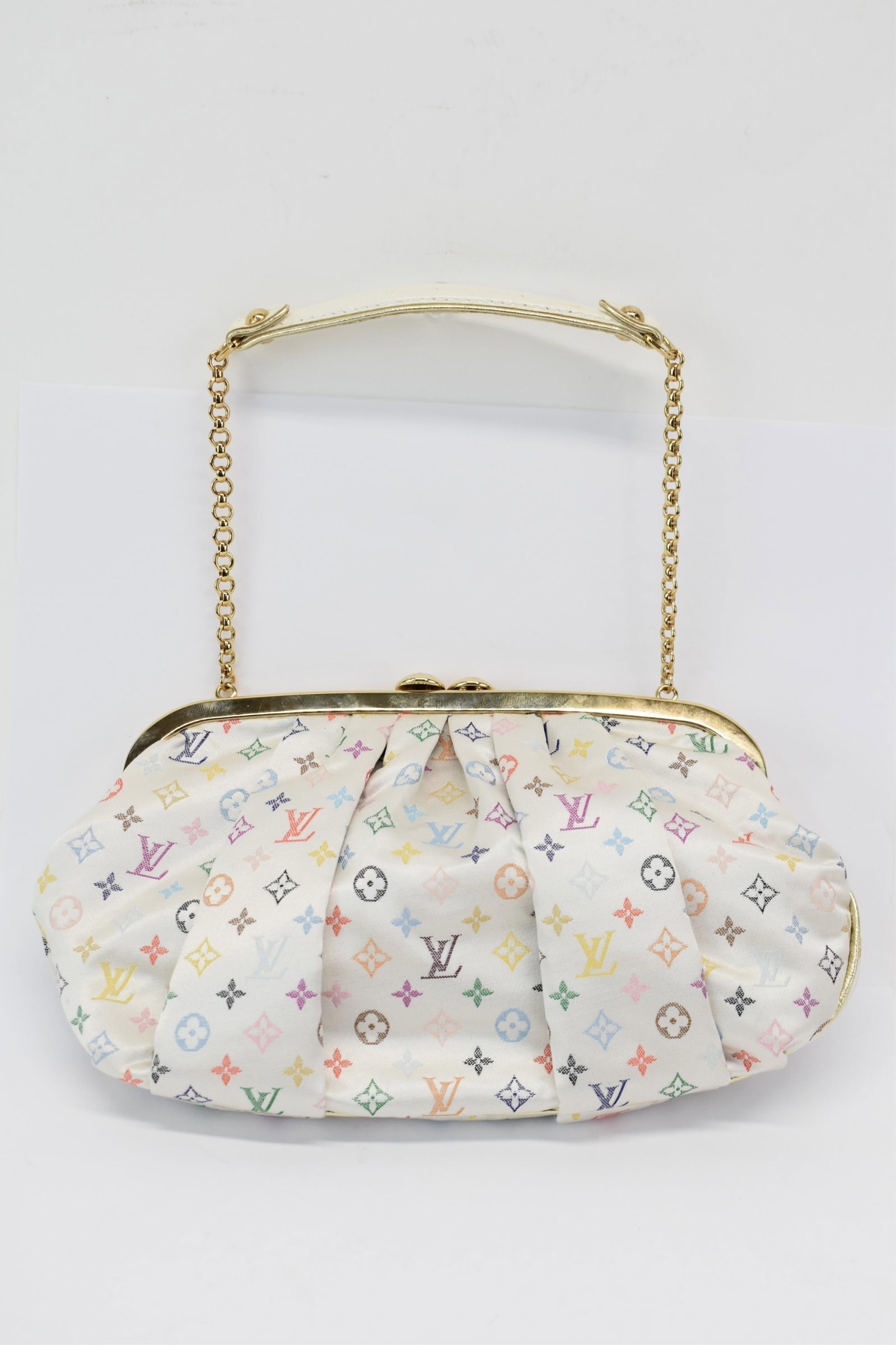 Louis Vuitton Satin Multicolor Aumoniere: Louis Vuitton Satin Multicolor AumoniereLouis Vuitton Satin Multicolor Monogram Evening Bag/Clutch has gathered satin multicolor signatue LV pattern on the outside and is trimmed in Ayers (water snake