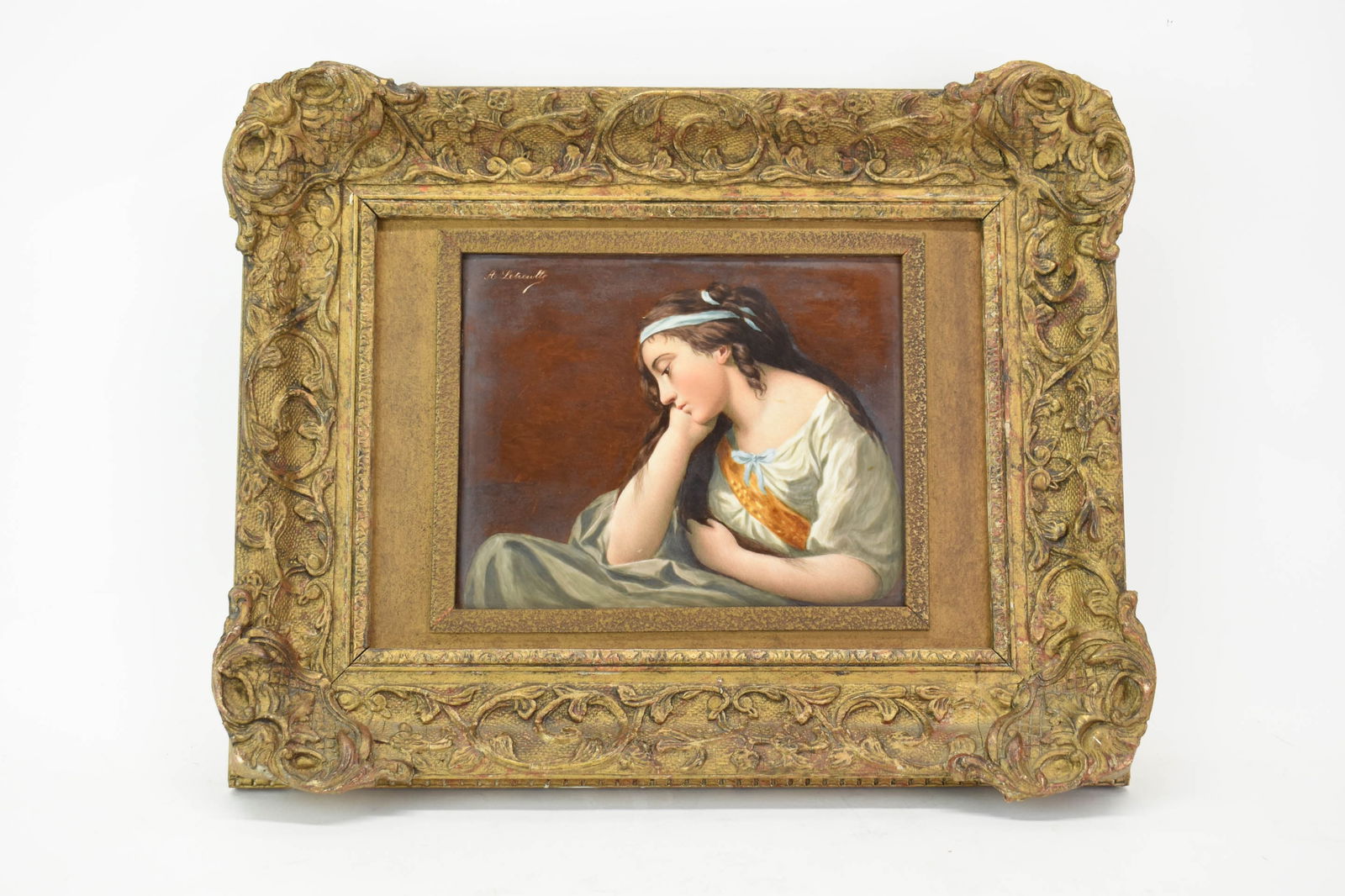 A. Letreulle Porcelain Titled Melancholy: A. Letreulle Porcelain Titled Melancholy A. Letreulle Painted Porcelain Plaque of a young girl, titled “Melancholy,” after the painting by Louis-Jean Lagrenee in an ornate gilt frame, signed