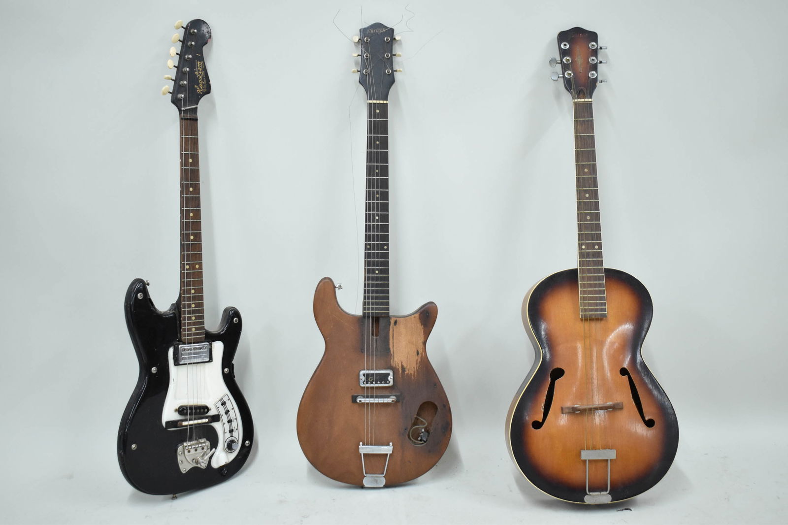 Three Guitars: Three Guitars Three Guitars, comprising, an acoustic Framas-Werke Bavaria, a Gretsch electric guitar, and a Hagstrom electric guitar. Used condition, wear, worn, not tested for working condition.