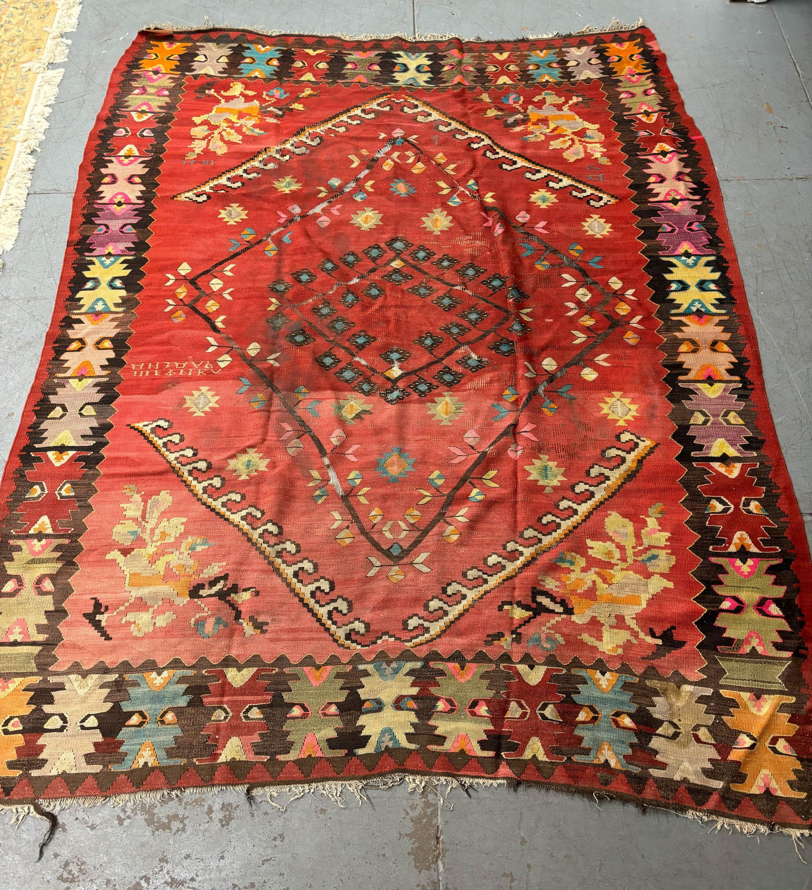 Kilim Style Room Size Rug: Kilim Style Room Size Rug Kilim Style Room Size Rug having red ground with floral and geometric design. Used condition, wear, worn, wholes, tears, losses. 123" x 97"