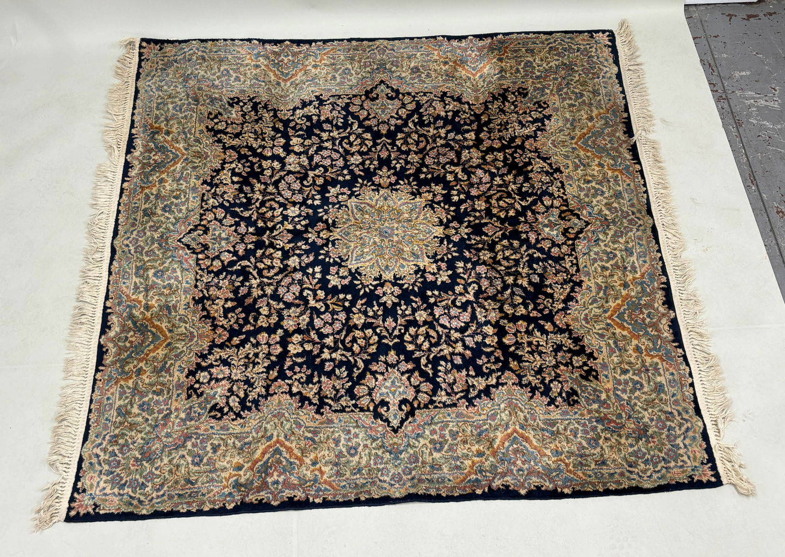 Oriental Style Area Rug: Oriental Style Area Rug Oriental Style Area Rug having central blue ground with floral and foliate design. Used condition, wear, worn. 79" x 71"