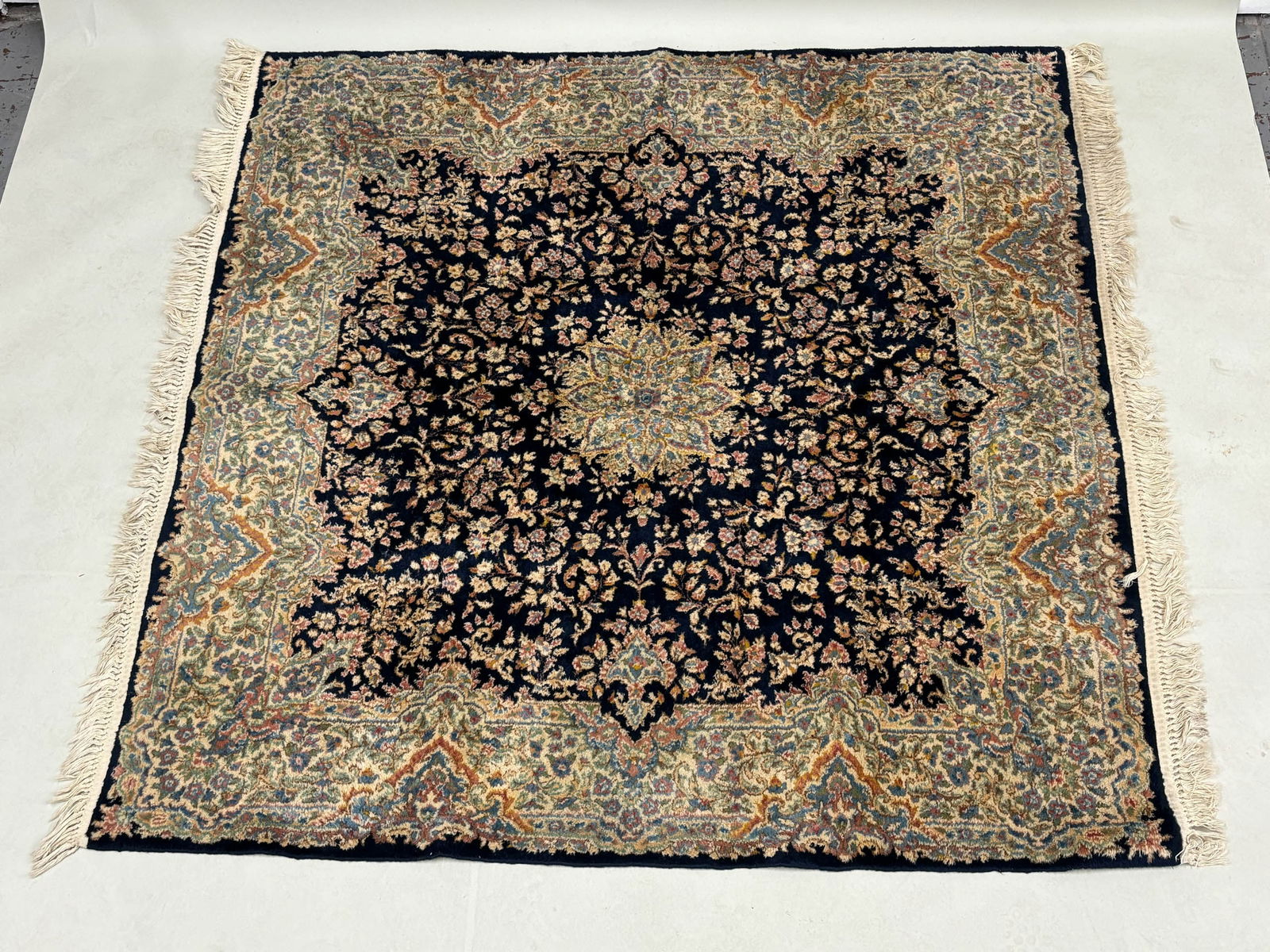 Oriental Style Area Rug: Oriental Style Area Rug Oriental Style Area Rug having central blue ground with floral and foliate design. Used condition, wear, worn. 79" x 73"