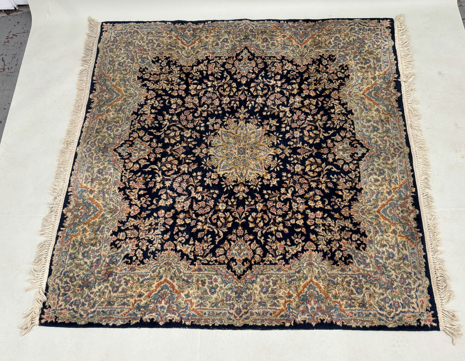 Oriental Style Area Rug: Oriental Style Area Rug Oriental Style Area Rug having central blue ground with floral and foliate design. Used condition, wear, worn. 79" x 73"