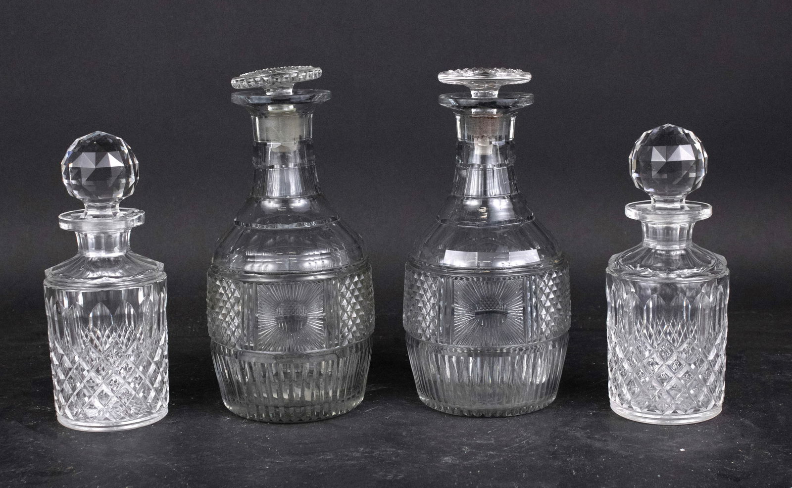 Four Vintage Cut Glass Decanters: Four Vintage Cut Glass Decanters 9 in. (22.9 cm.), Frame: 7 in. (17.8 cm.)