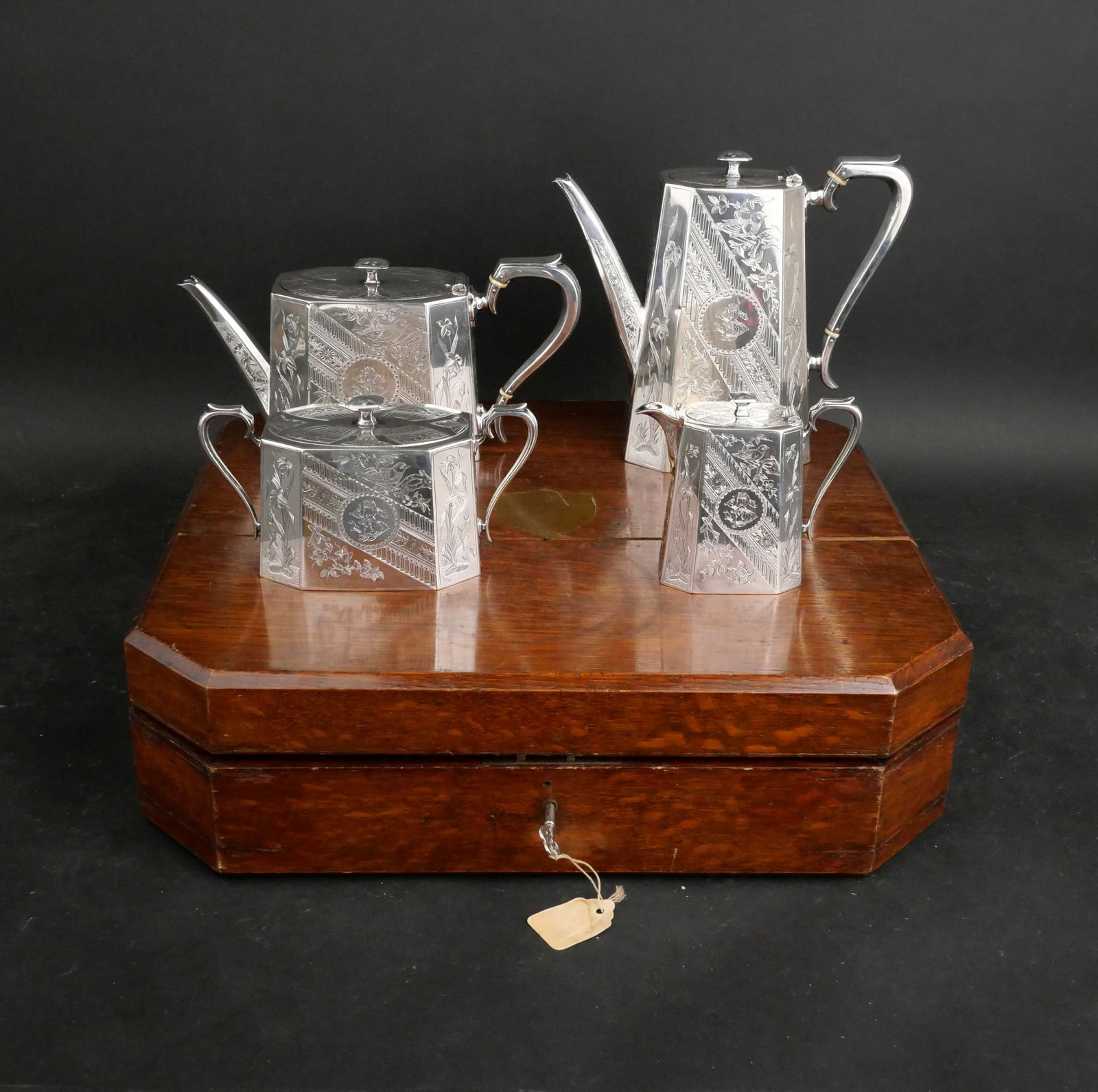 Aesthetic Movement English Silver Tea Set: Aesthetic Movement English Silver Tea Set Of impressive size and fitted oak box. Richard Martin and Ebenezer Hall for Martin Hall, London. 1885. Bright cut with birds and foliage. Comprising a teapot