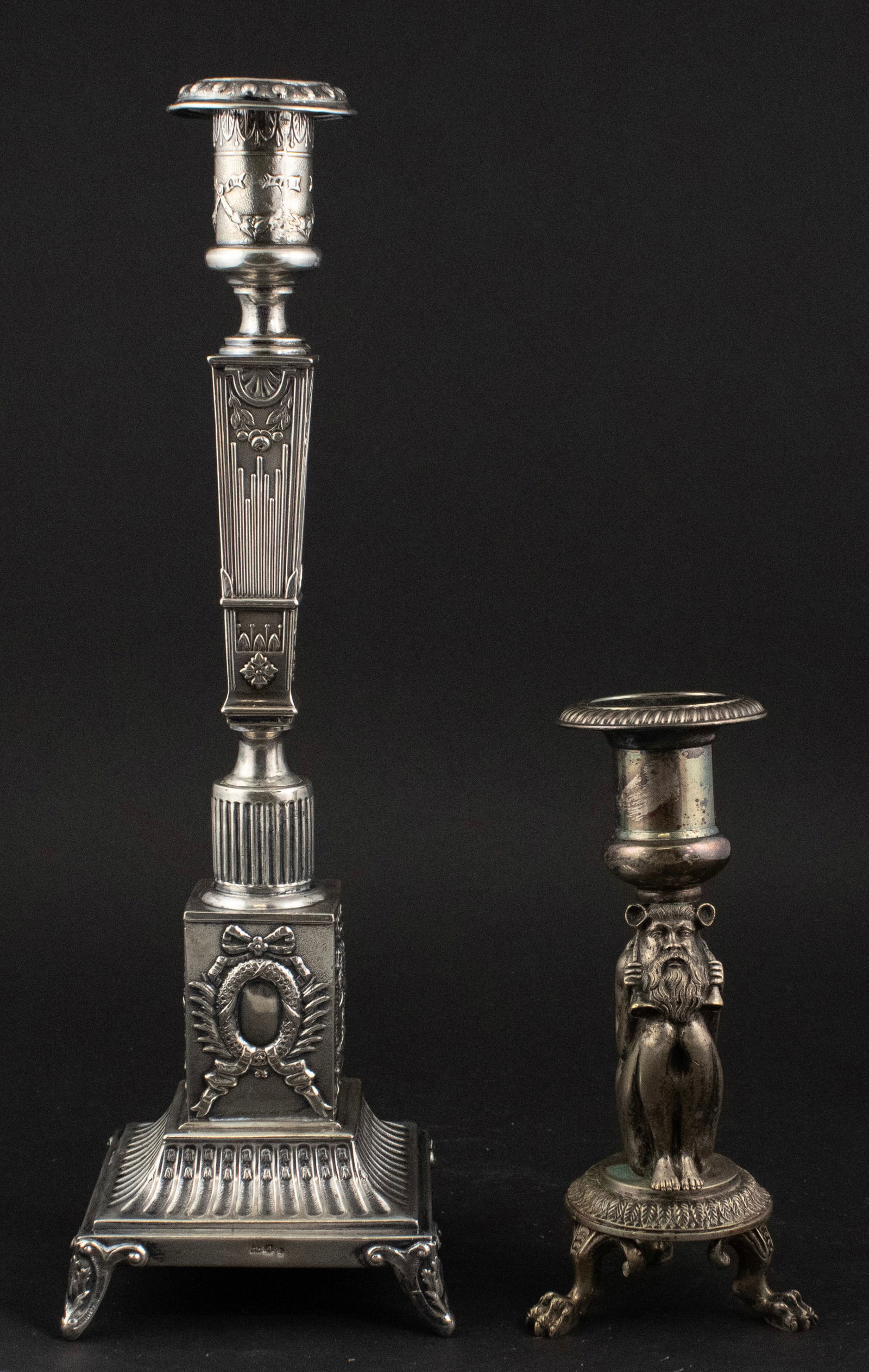 Continental Silver Neoclassical Candlestick: Continental Silver Neoclassical Candlestick With ribbon and laurel decorations. Approx. 11 t.o. Together with an unmarked and not weighed mystical figure candlestick on claw feet. 14 1/2 in. (36.8