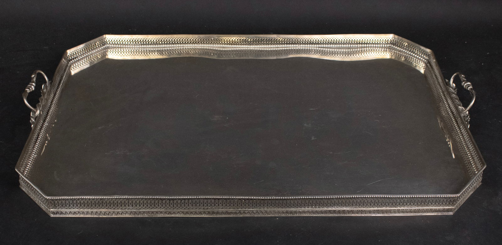 Continental Silver Galleried Double Handled Tray: Continental Silver Galleried Double Handled Tray Of impressive size, Tray with wood frame. 19 x 27 1/2 in. (48.3 x 69.9 cm.)