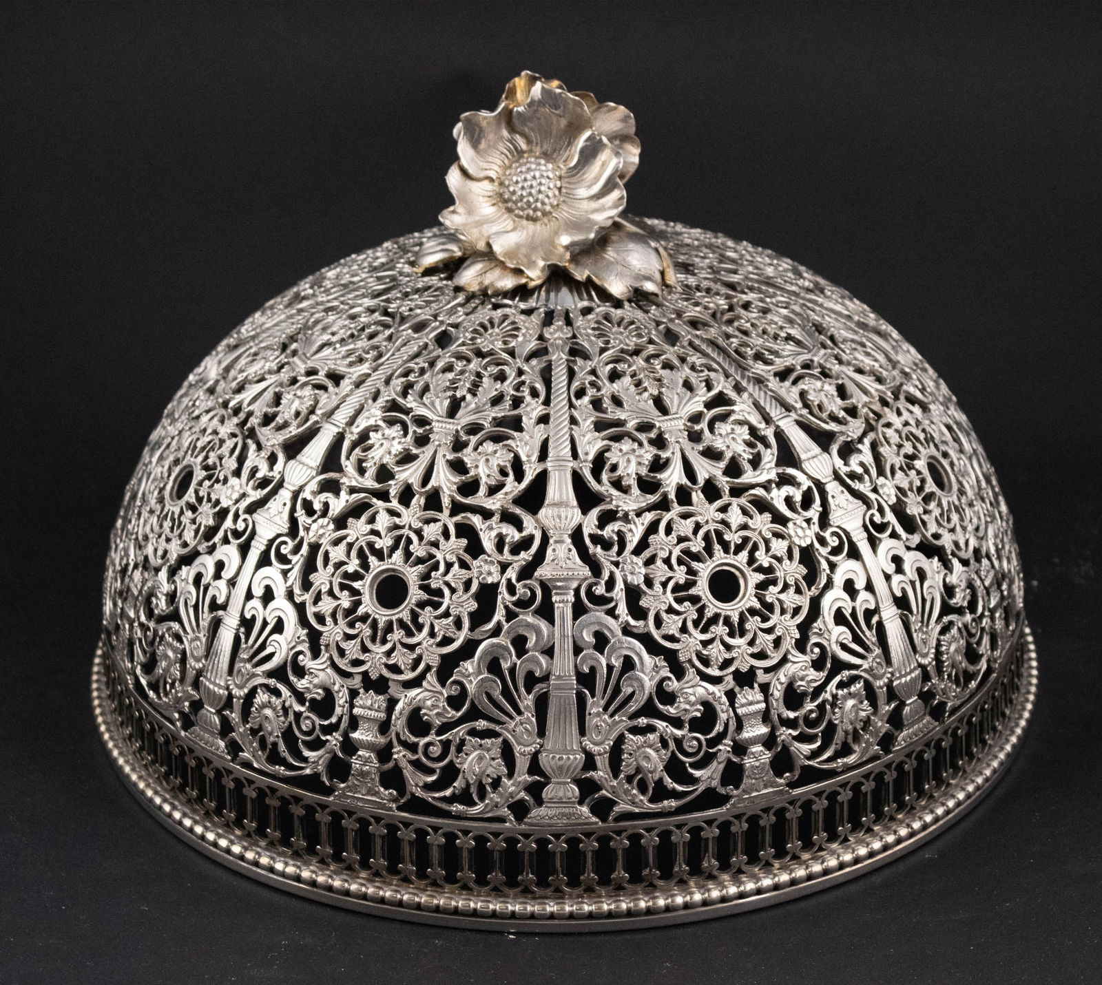 Adler Sterling Silver Reticulated Dome Cloche: Adler Sterling Silver Reticulated Dome Cloche Of impressive size and floral decoration. The dome shaped food cover is decorated with large flower finials. . Approx. 49 t.o. 7 1/2 x 11 in. (19.1 x