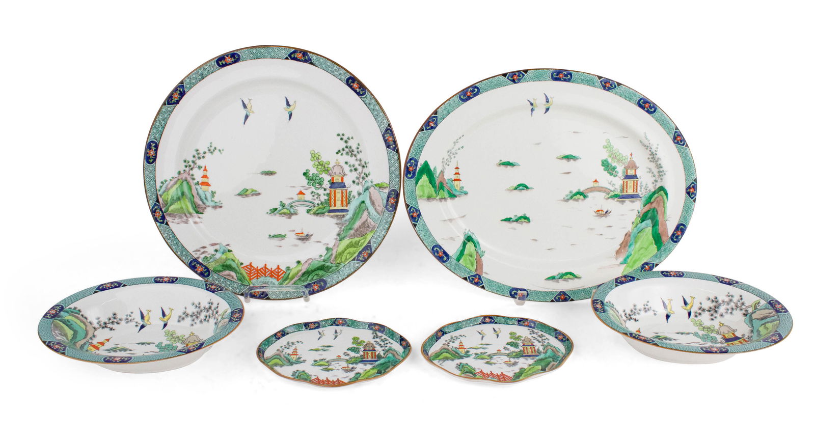 Six "Chinese Willow" Pattern Serving Pieces: Six "Chinese Willow" Pattern Serving PiecesComprising, two Staffordshire oval bowls, two Staffordshire shaped plates, a Tiffany & Co. Staffordshire round platter, and an Aynsley oval platter made for