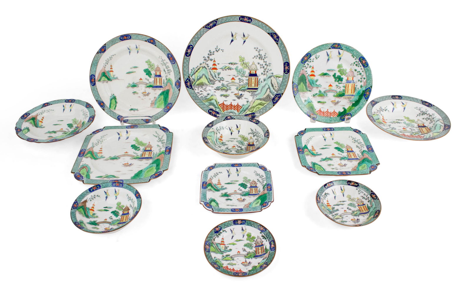 Assembled Set of "Chinese Willow" Pattern Dinnerware: Assembled Set of "Chinese Willow" Pattern Dinnerware Comprising, 7 dinner plates, 13 salad plates, 12 luncheon plates, 4 cream soup bowls in two sizes, 29 bread plates, a small plate, 15 cereal