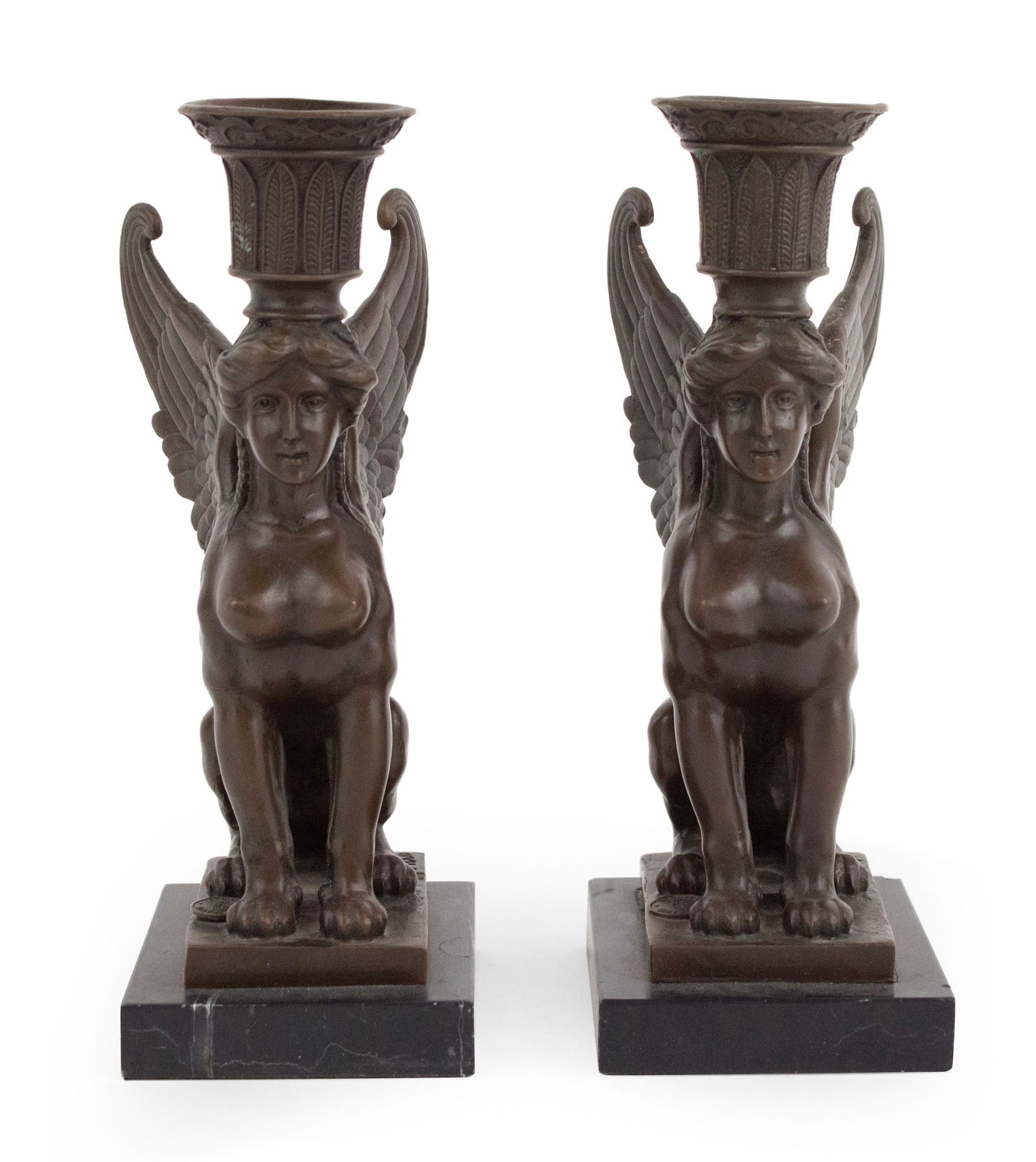 Pair of Egyptian Revival Bronze Candle Holders: Pair of Egyptian Revival Bronze Candle Holders20th C. sphinx form on marble bases.Some surface distress.8 3/4 x 3 1/4 x 4 in. (22.2 x 8.3 x 10.2 cm.)