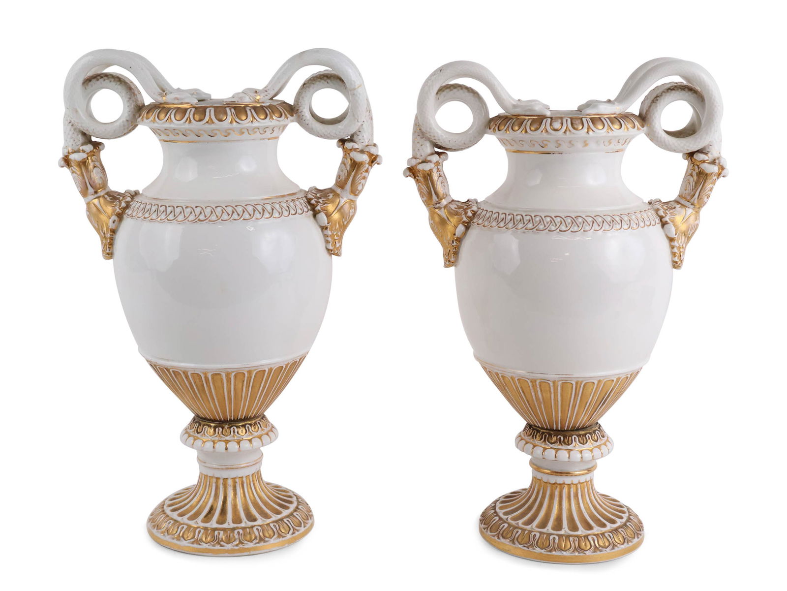 Pair of Meissen Neoclassical Style Parcel-Gilt Urns: Pair of Meissen Neoclassical Style Parcel-Gilt Urns Marked underside, with snake-form handles. Wear to gilt, cracks and repairs. 15 x 10 x 6 1/2 in. (38.1 x 25.4 x 16.5 cm.)
