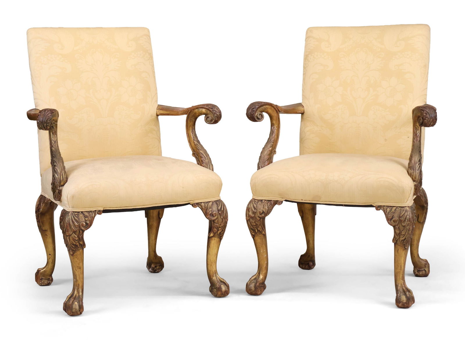 Pair of George II Style Giltwood Library Armchairs: Pair of George II Style Giltwood Library Armchairs20th C. with pale yellow damask upholstery.Surface distress and wear.Provenance: Formerly in the Pierre Hotel, New York, NY42 3/4 x 30 1/2 x 23 1/2 in