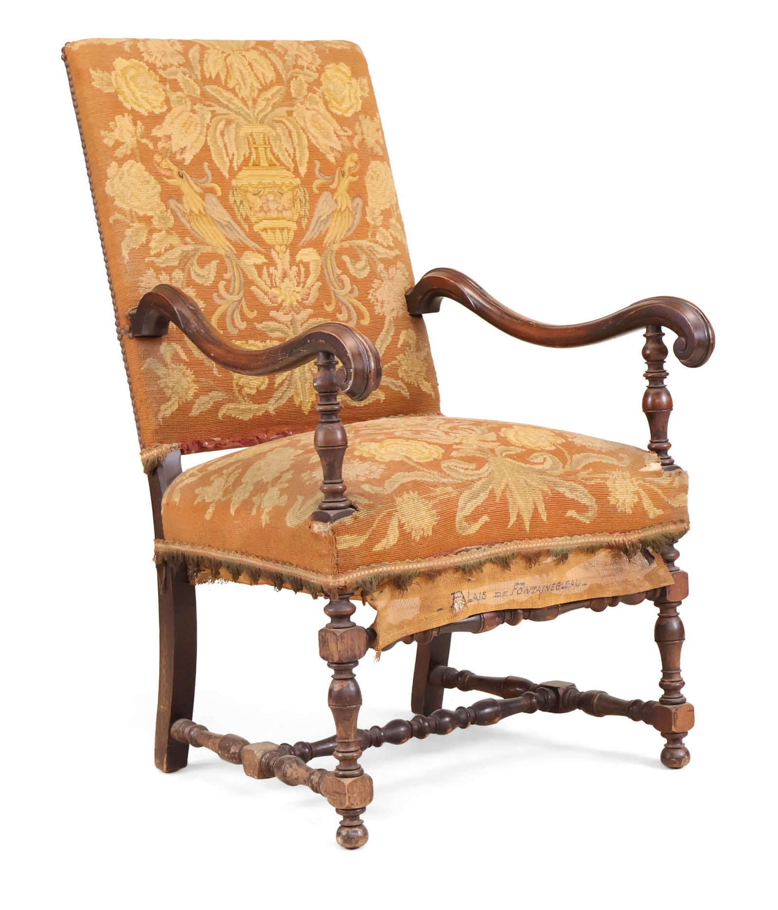 Louis XIII Needlepoint Upholstered Library Armchair: Louis XIII Needlepoint Upholstered Library ArmchairFrench, 19th C. "Palais de Fontainebleau" inscribed on fabric. Losses to fabric, surface distress and wear.44 1/4 x 25 1/2 x 27 in. (112.4 x 64.8 x 6