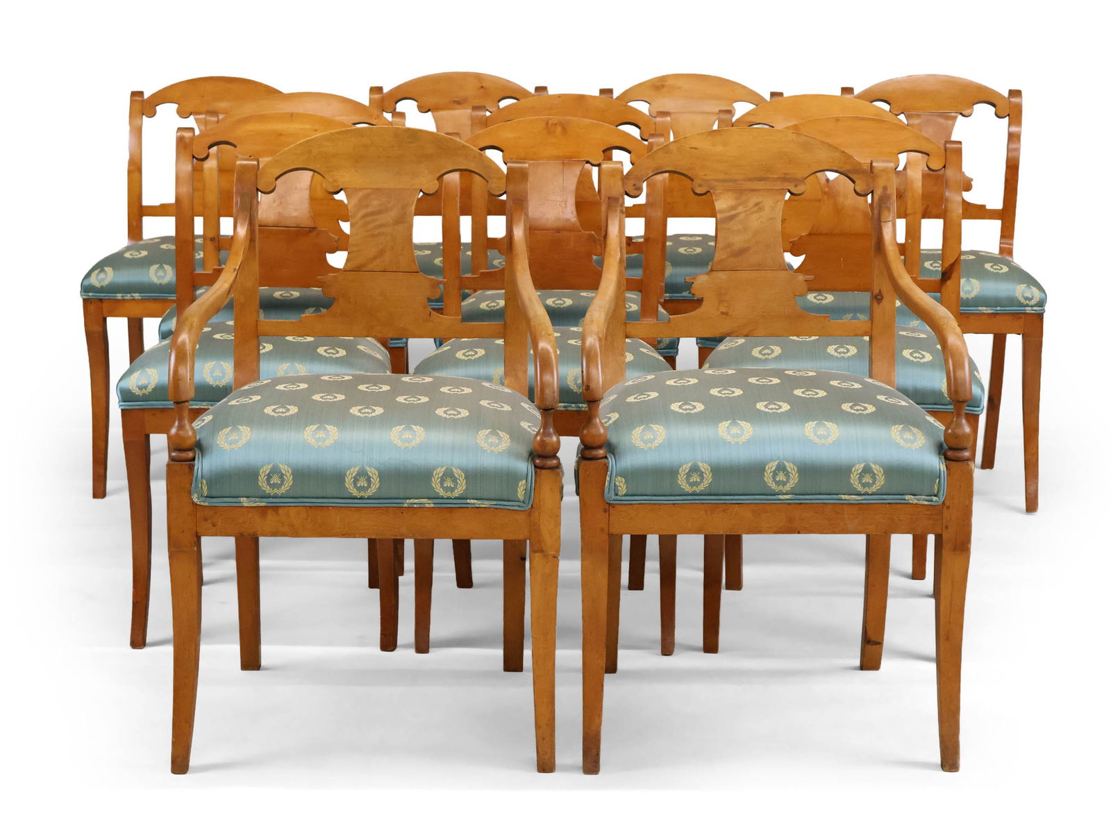 Twelve Biedermeier Birchwood Dining Chairs: Twelve Biedermeier Birchwood Dining ChairsContinental, 19th C. with green upholstery, comprising, 2 armchairs and 10 side chairs. Seats re-covered in blue and gold wreath patterned fabric.Side: 32 3/4