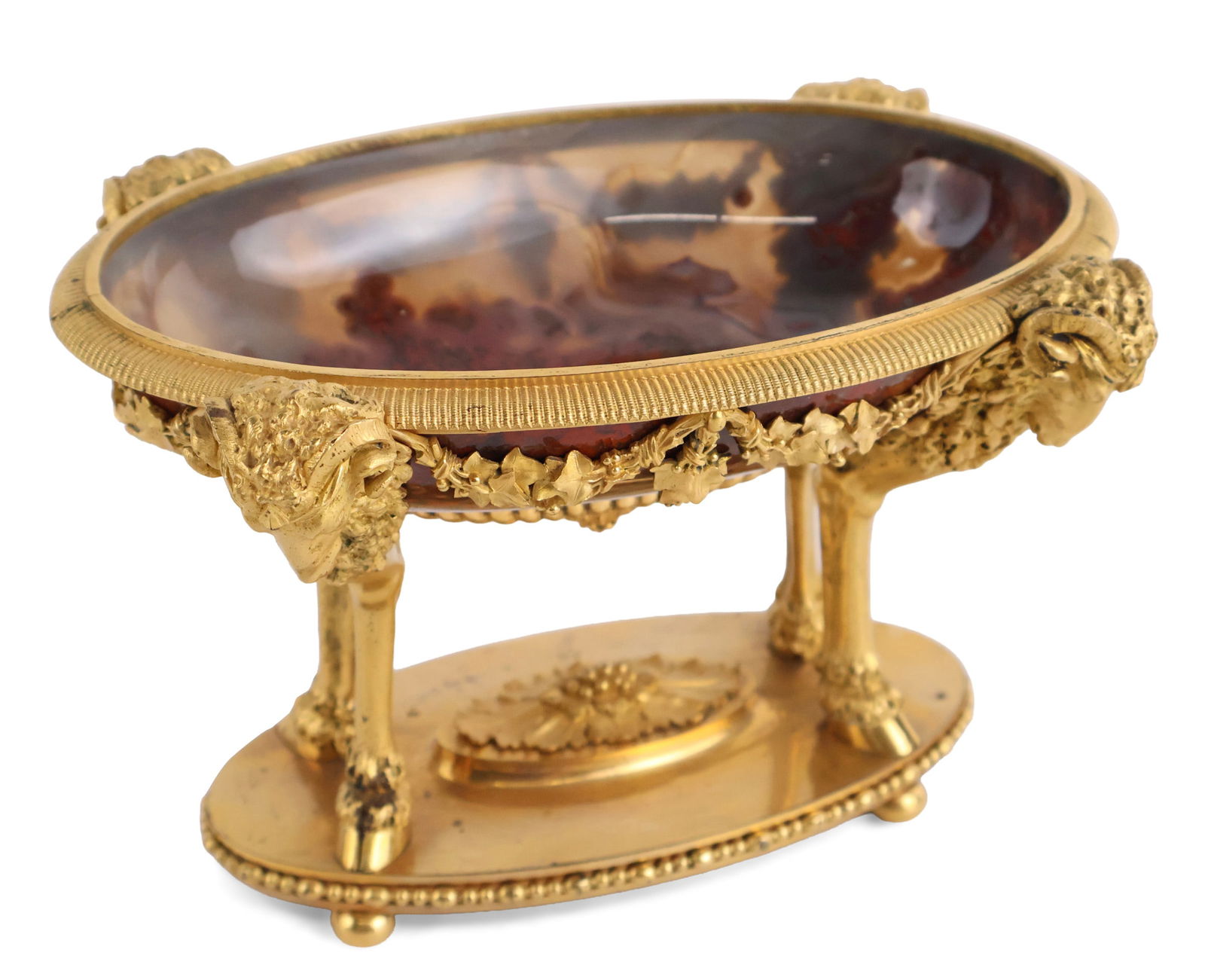 Neoclassical Gilt-Bronze Mounted Agate Oval Bowl: Neoclassical Gilt-Bronze Mounted Agate Oval Bowl Continental, Second half 19th C. the shallow agate dish within a gadrooned rim, supported by four rams' headed monopodia festooned with ivy garlands