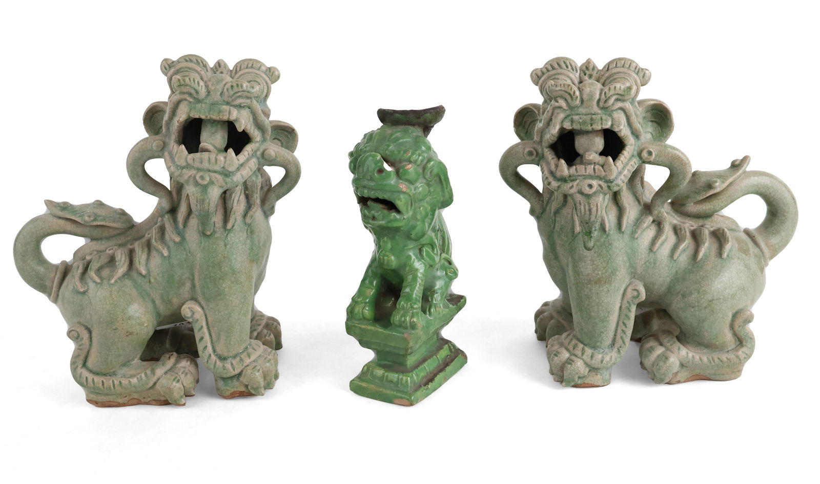 Pair of Chinese Celadon Fu Dogs: Pair of Chinese Celadon Fu Dogs 19th/20th C. Together with a green glazed Chinese fu lion. 3 pieces Losses, crazing. Pair: 9 3/4 x 10 x 4 1/4 in. (24.8 x 25.4 x 10.8 cm.)