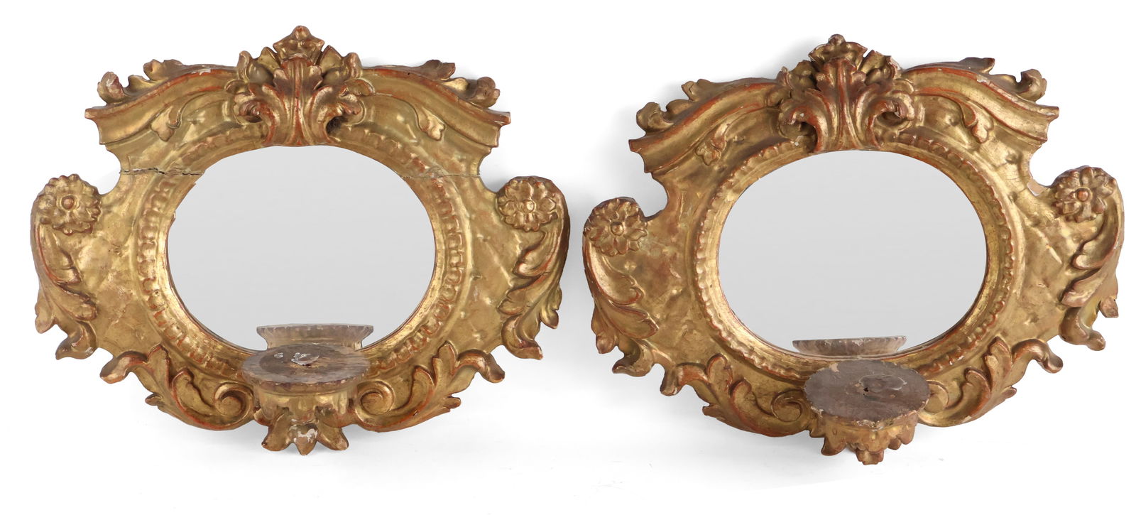 Pair of Rococo Giltwood Mirrors with Candle Holders: Pair of Rococo Giltwood Mirrors with Candle Holders Continental, 19th C. Losses to gilt, restorations. 15 1/4 x 18 1/2 x 7 in. (38.7 x 47 x 17.8 cm.)