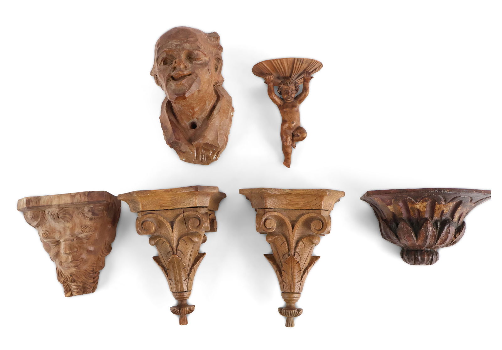 Pair of Italian Florentine Carved Oak Wall Brackets: Pair of Italian Florentine Carved Oak Wall Brackets 20th C. Together with a putti holding a shell wall bracket, a bearded man figural wall bracket, a carved and painted wood wall bracket, and a