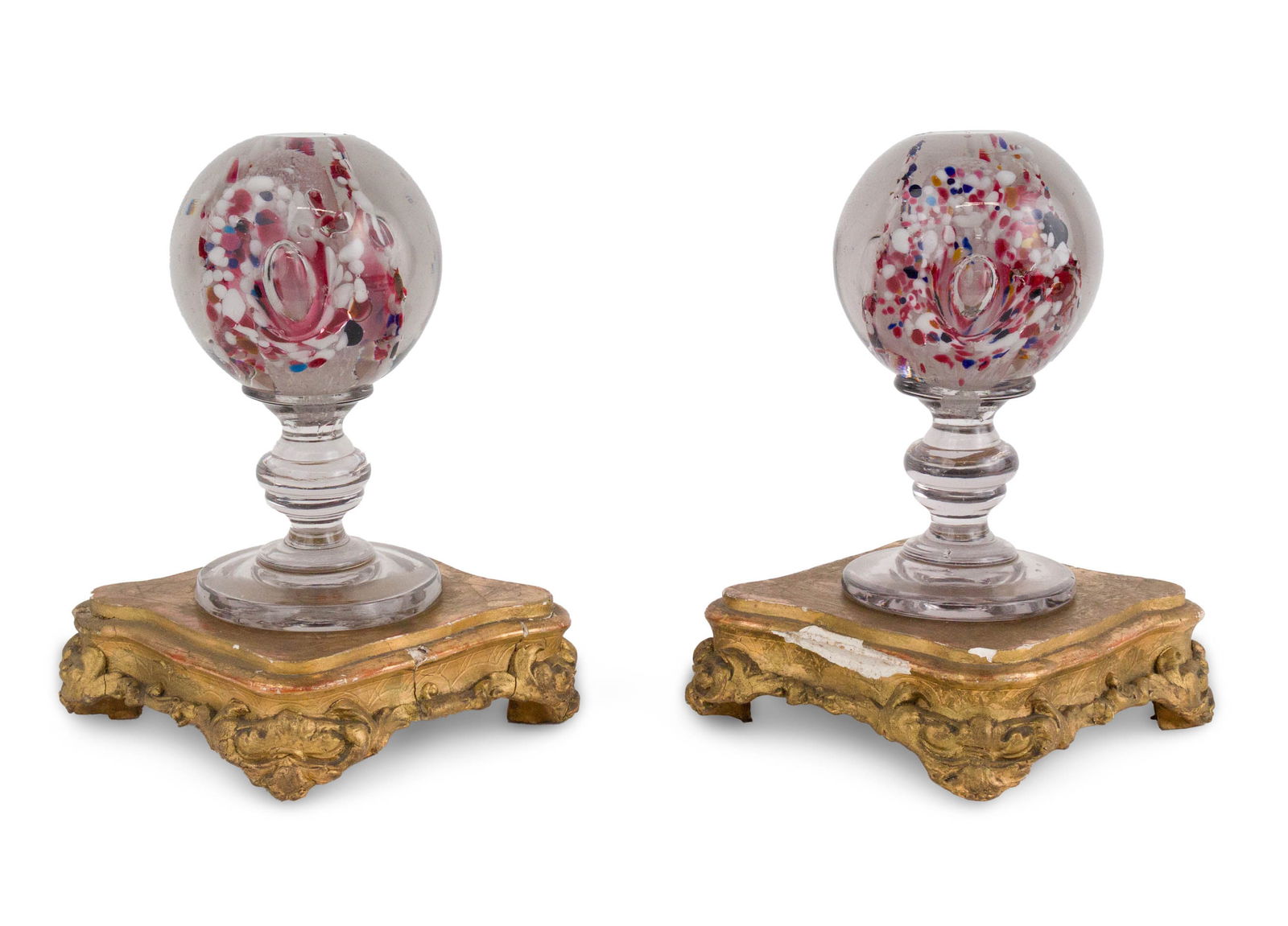 Pair of Art Glass Footed Orbs: Pair of Art Glass Footed Orbs Together with a pair of giltwood plinths. 4 pieces Losses, surface distress. Orbs: 6 3/4 x 3 1/2 in. (17.1 x 8.9 cm.), Plinth: 2 x 7 1/2 x 7 in. (5.1 x 19.1 x 17.8 cm.)