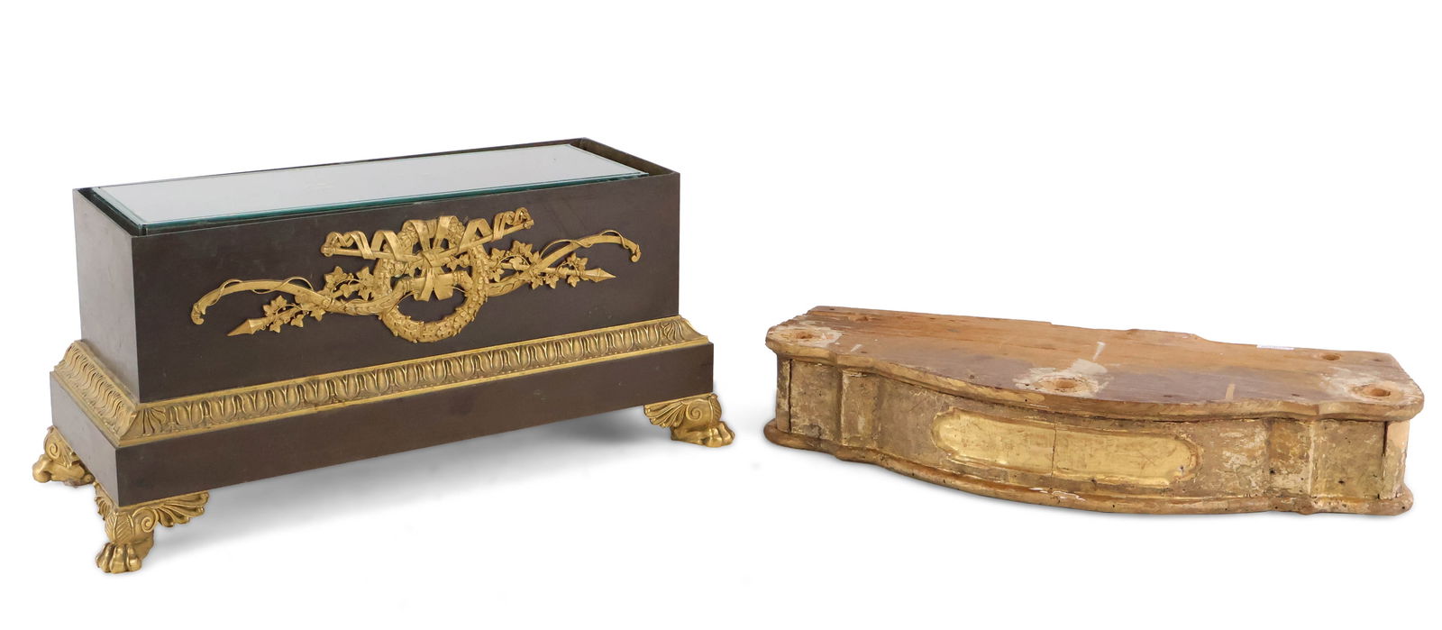 Neoclassical Ormolu-Mounted Clock Base: Neoclassical Ormolu-Mounted Clock Base 19th/20th C. Together with a giltwood plinth. 2 pieces Losses, wear, surface distress. 3 x 17 3/4 x 6 3/4 in. (7.6 x 45.1 x 17.1 cm.), and 8 x 18 x 7 3/4 in.