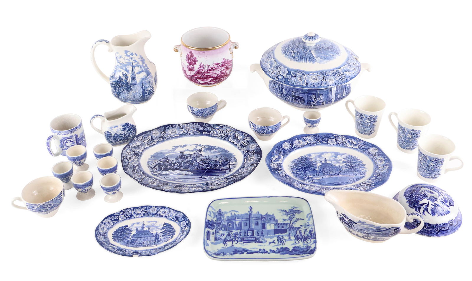 Group of Blue Transferware Table Articles: Group of Blue Transferware Table Articles Including, egg cups marked "Japan", mugs marked "England", a creamer, soup tureen, pitcher, and gravy boat marked "Liberty Blue Historic Colonial Scenes",