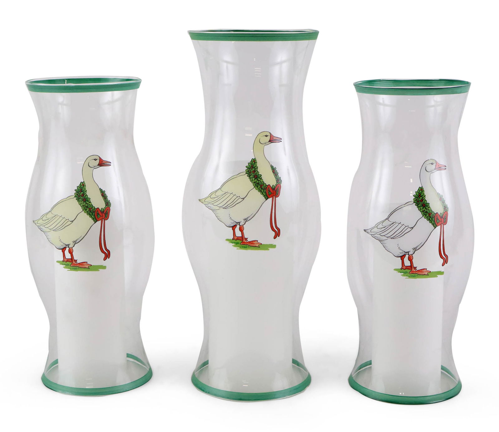 Three Christmas Goose Hurricane Shades: Three Christmas Goose Hurricane Shades 20th/21st C. two sizes. 14 x 5 1/2 in. (35.6 x 14 cm.), and 16 1/4 x 6 1/2 in. (41.3 x 16.5 cm.)