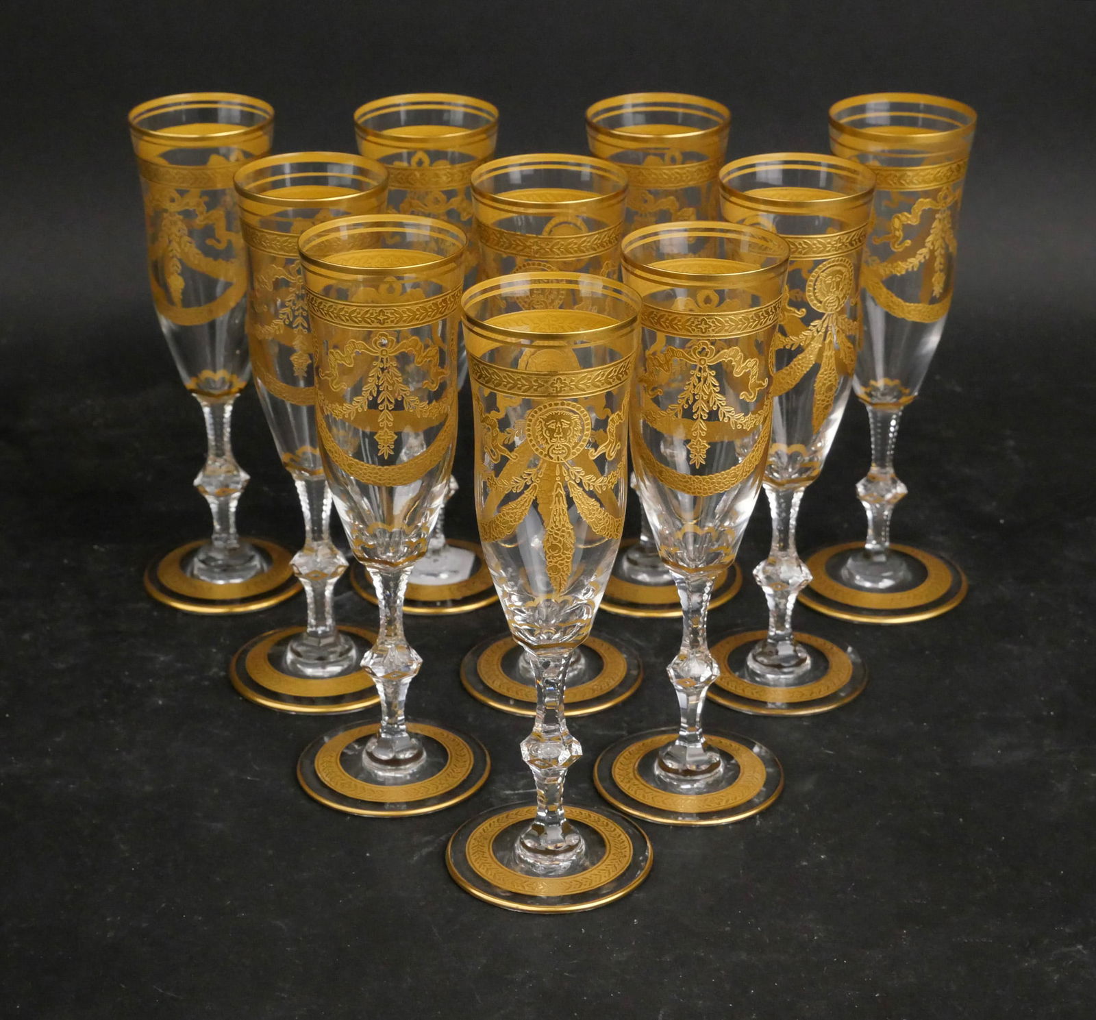 Ten St. Louis Crystal "Congress" Champagne Flutes: Ten St. Louis Crystal "Congress" Champagne Flutes Clear crystal with gold-encrusted lion medallions, elaborate swags, and banded borders. 7 5/8 x 2 5/8 in. (19.4 x 6.7 cm.)