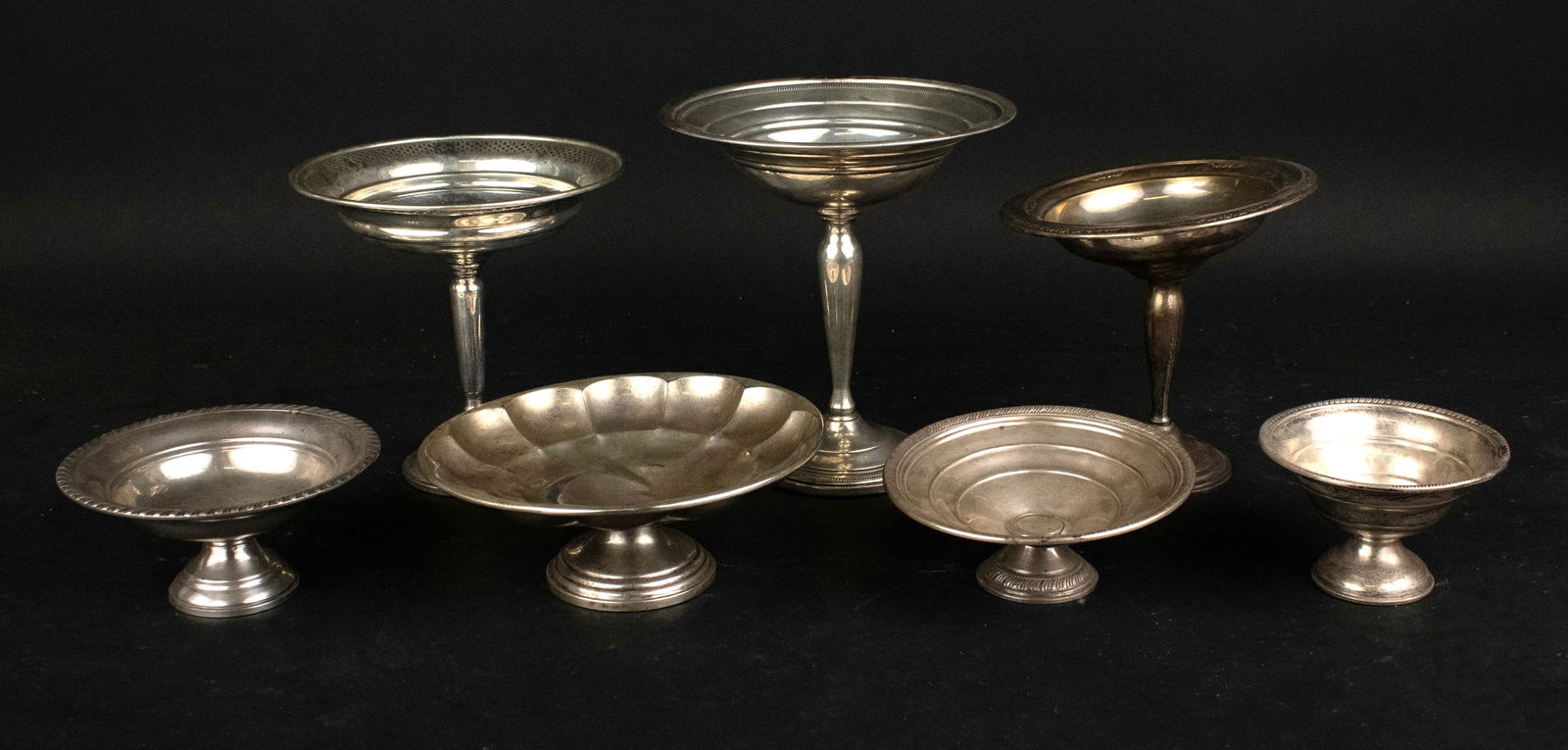 Seven Sterling Silver Footed Tazzas and Bowls: Seven Sterling Silver Footed Tazzas and Bowls All weighted, distressed. 7 in. (17.8 cm.)