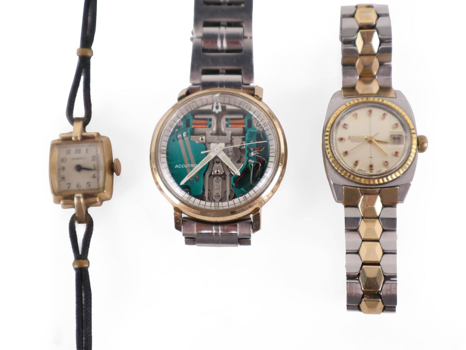 Three Vintage Watches, Bulova Accutron: Three Vintage Watches, Bulova Accutron Comprising, a Seiko steel backed watch, automatic, 21 jewels, 7"l, a Bulova 10k gold filled watch, a Bulova Accutron with open face, 7"l, a Longines 10k gold