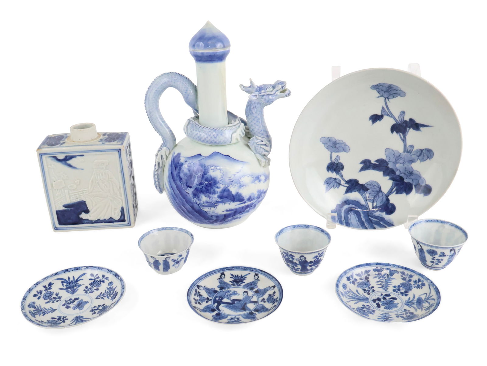 Six Chinese Blue and White Table Articles: Six Chinese Blue and White Table Articles Comprising, a dragon-decorated pitcher, a tea caddy, a shallow bowl, and three teacups and saucers. Chips, wear, surface distress. Largest: 10 1/4 x 7 1/4