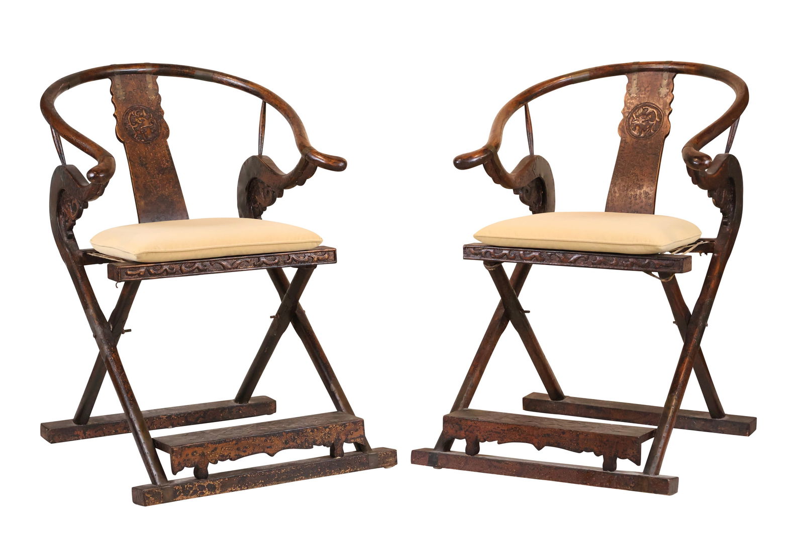 Pair of Chinese Folding Horseshoe Back Chairs: Pair of Chinese Folding Horseshoe Back Chairs With brass mounts and black stain/paint. Used by officials to take from village to village. Some wear. 40 1/2 x 27 x 32 in. (102.9 x 68.6 x 81.3 cm.)