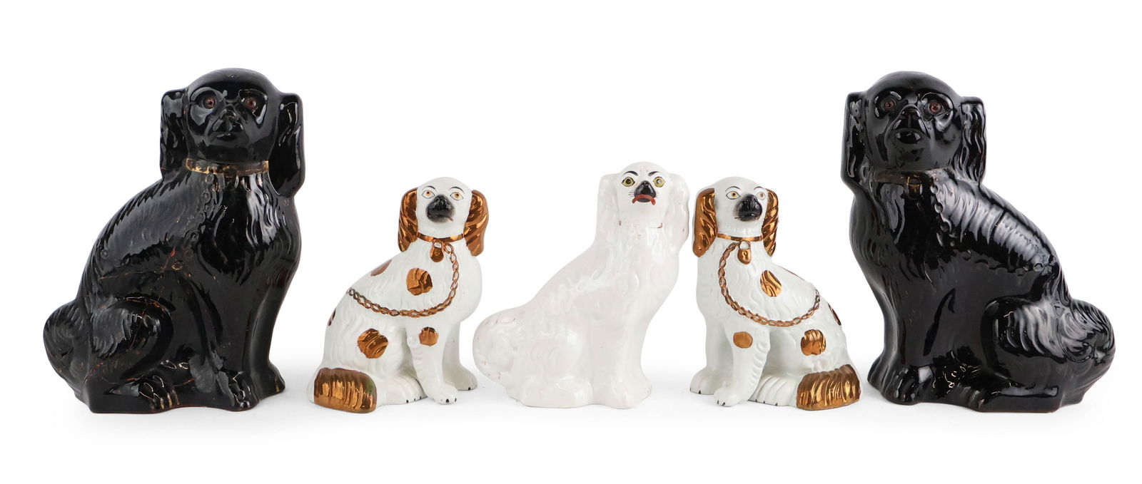 Group of Staffordshire Dogs: Group of Staffordshire Dogs English, 19th/20th C. Comprising a pair in white with gilt decoration, a single white example, and a brown pair (one repaired). From 9 1/2 in. (24.1 cm.), to 13 3/4 in.