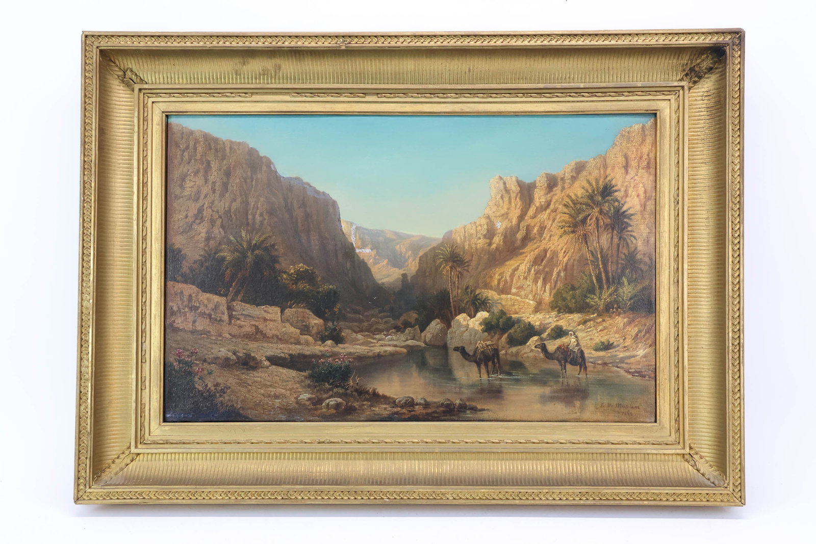 Julius Montalant Antique Oil on Canvas of Arabian Landscape: Julius Montalant Antique Oil on Canvas of Arabian LandscapeAntique Oil on Canvas of Arabian Landscape depicting camels streamside surrounded by mountain valley with palm trees. Signed lower right Juli
