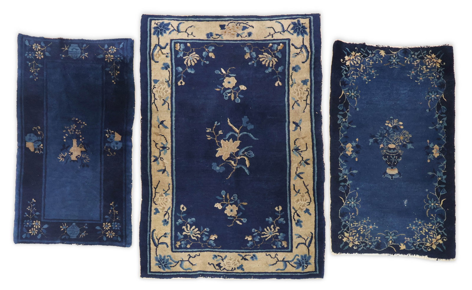 Three Peking Chinese Rugs: Three Peking Chinese RugsChina, first 1/4 20th C.57 x 38 1/2, 44 3/4 x 24 1/4, and 45 x 25 1/2