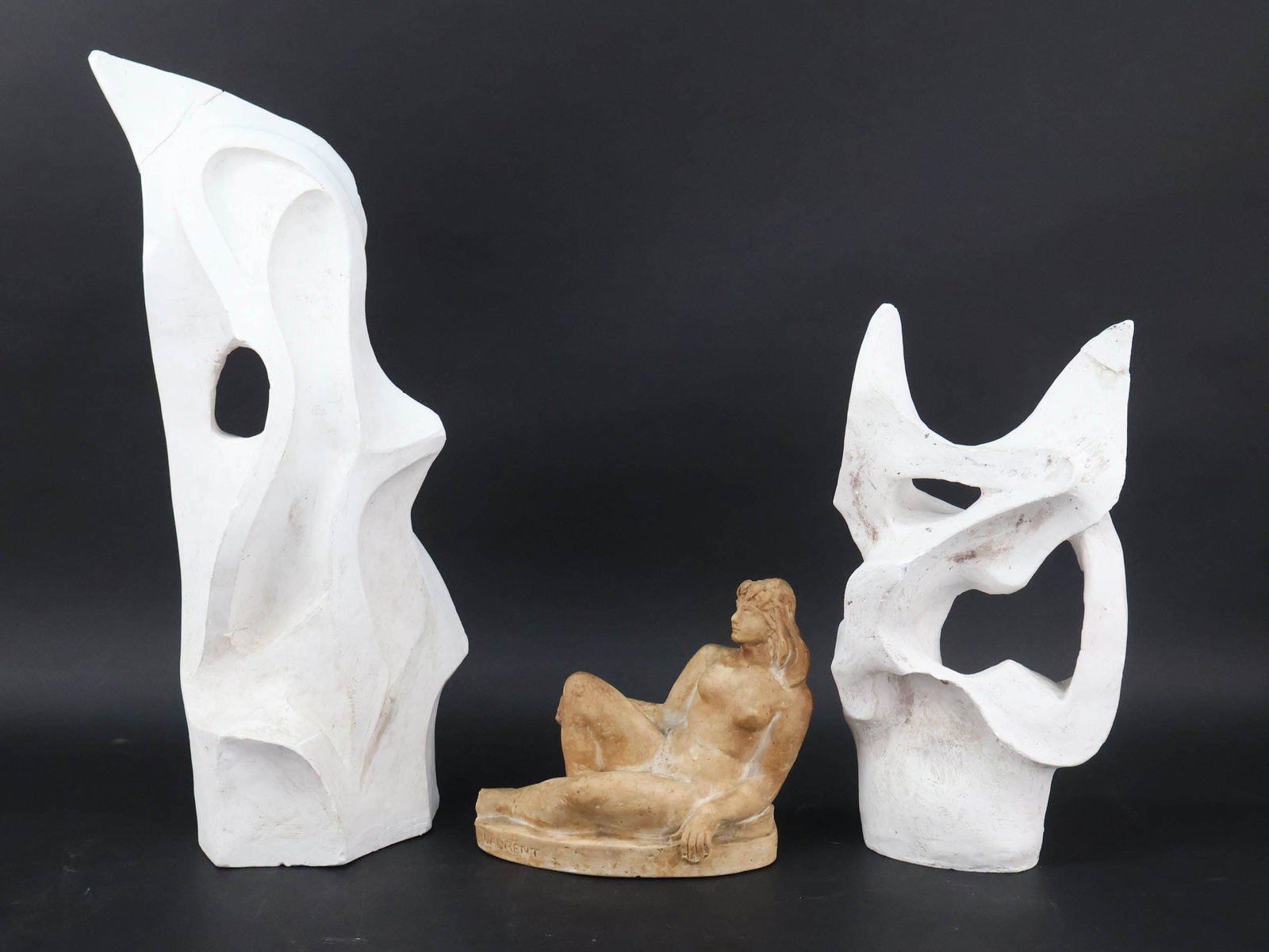 Robert Laurent, 1890-1970, Reclining Nude, Painted Plaster: Robert Laurent 1890-1970 Reclining Nude Painted Plaster Signed "Laurent", "Robert Laurent" and "Reclining Nude (No. 7) Robinson Galleries, Inc., New York". Together with two abstract plaster