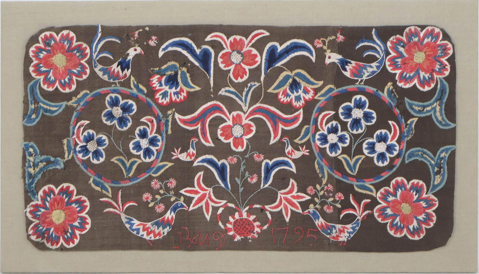 English Embroidered Table Rug: English Embroidered Table Rug Initialed "BMD" and "1795." Mounted on a wood frame. Rug: 19 1/2 x 37 1/2 in. (49.5 x 95.3 cm.), Frame: 23 3/4 x 42 in. (60.3 x 106.7 cm.)