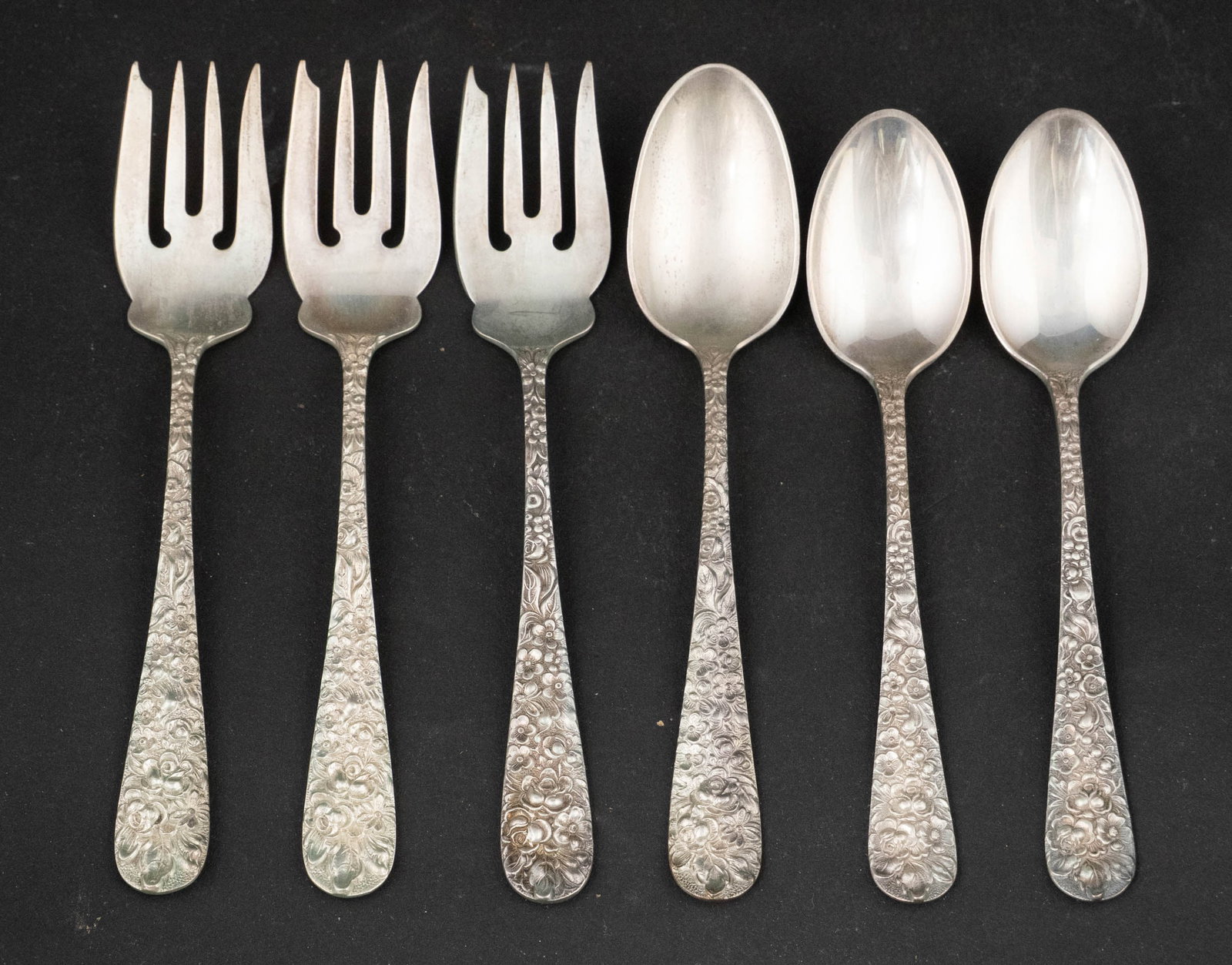 Stieff Sterling Silver Forks and Spoons: Stieff Sterling Silver Forks and Spoons All in repousse decorations. Including: six spoons, 5.5"l, six spoons, 5 7/8"l, ten four-tined forks, 6"l, and two four-tined forks, 6"l. Approx. 23 t.o. 6 in.