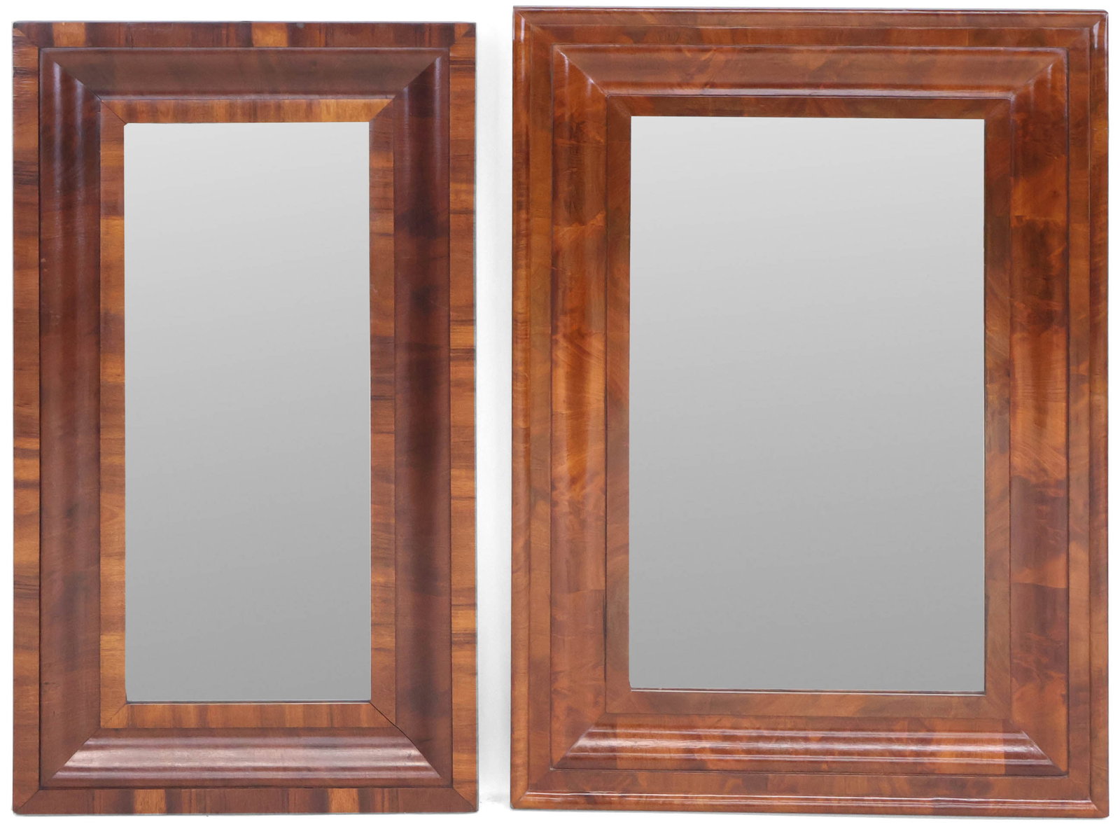 Two Empire Mahogany Mirrors: Two Empire Mahogany Mirrors American, 19th C. 34 1/2 x 19 in. (87.6 x 48.3 cm.), and 35 1/4 x 24 1/2 in. (89.5 x 62.2 cm.)
