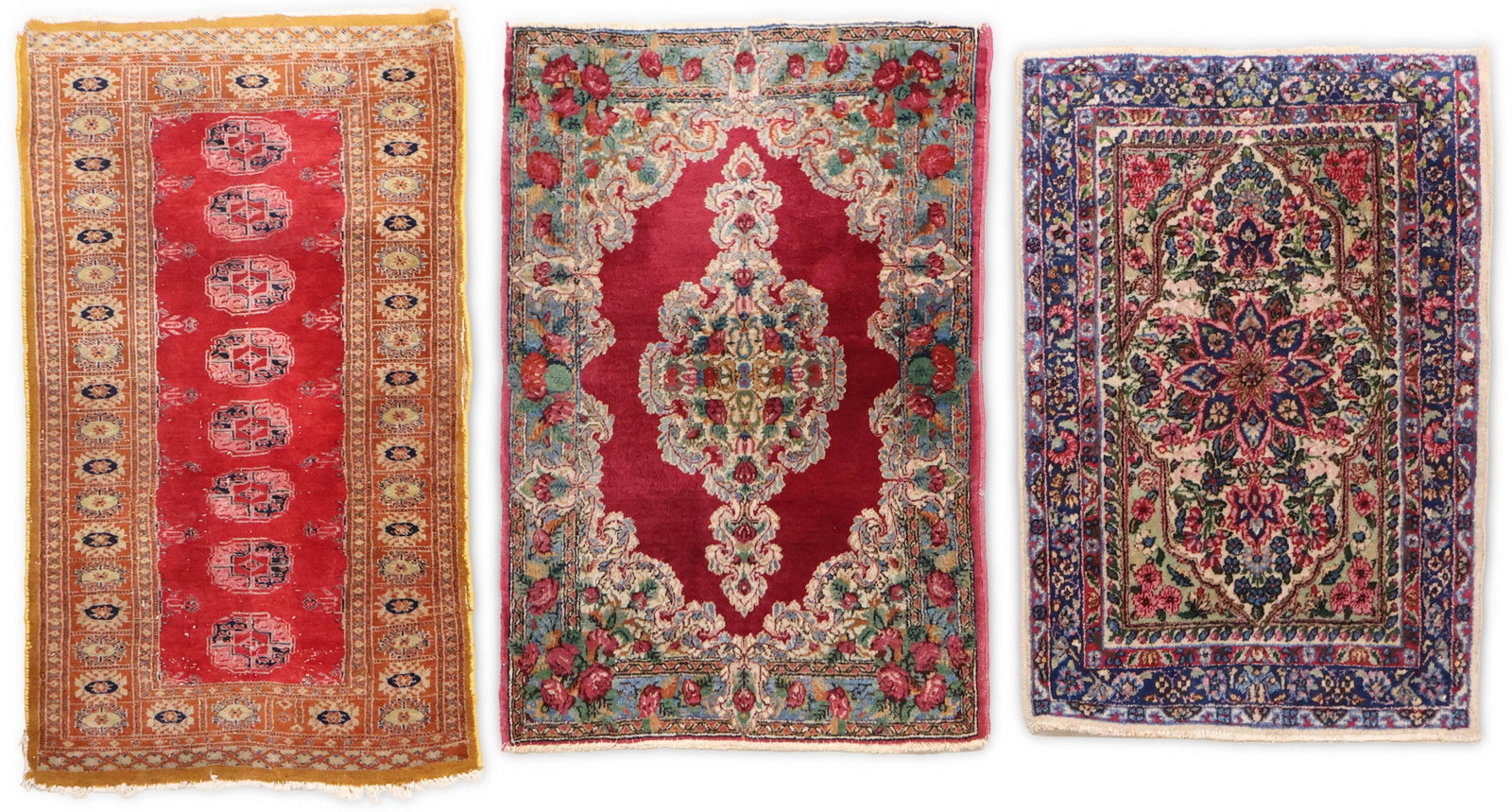 Two Kerman Rugs: Two Kerman Rugs Southeast Persia/Iran. Together with a Pakistan Bokhara rug. Bokhara: areas of wear, color rungs, reselvedged. 41 x 23 1/2, 35 x 24, and 37 1/2 x 25