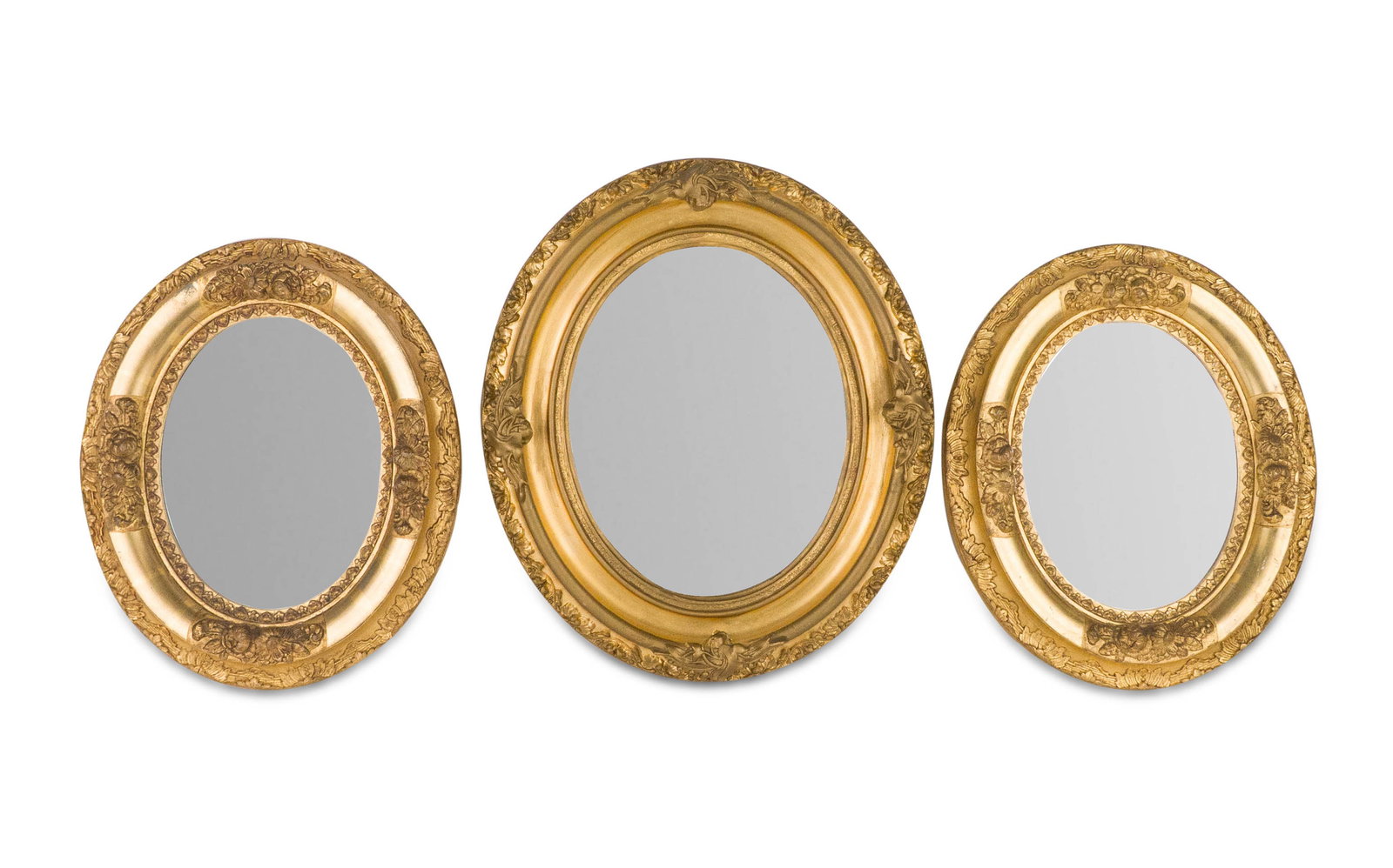 Three Victorian Oval Giltwood Mirrors: Three Victorian Oval Giltwood Mirrors Late 19th/20th C. comprising a pair and a single. 12 1/4 x 10 1/4 in. (31.1 x 26 cm.), and 14 1/4 x 12 1/4 in. (36.2 x 31.1 cm.)