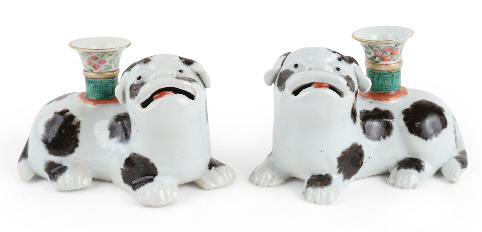Pair of Black and White Pug Candleholders: Pair of Black and White Pug Candleholders First half 19th C. The pups looking up with their tongues visible through open jaws, their coats enameled white with black patches and on their backs candleho