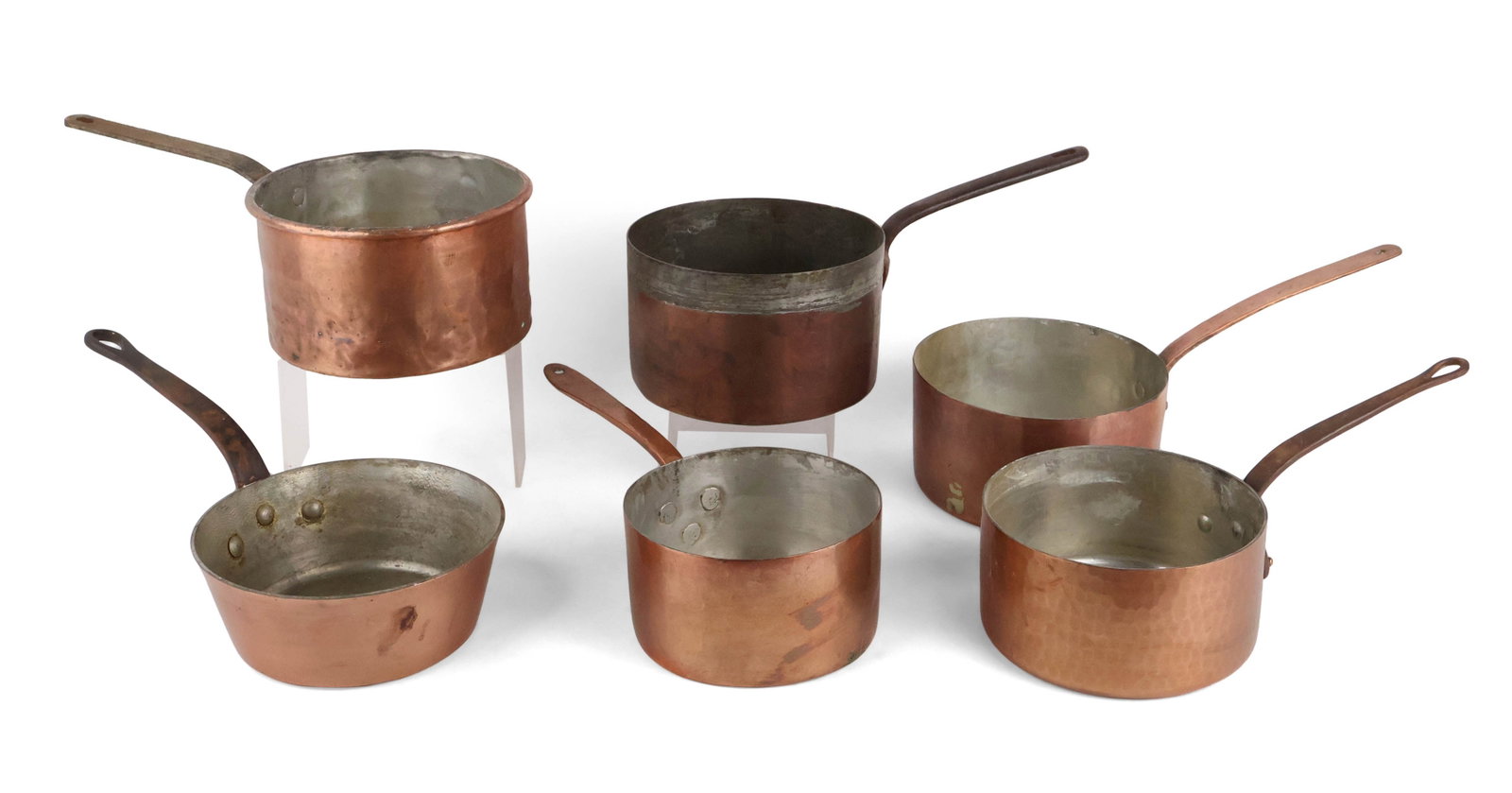 Six Copper Saucepots: Six Copper Saucepots 20th C. all without lids, some marked. Largest: 5 1/2 x 18 1/2 x 9 3/4 in. (14 x 47 x 24.8 cm.)